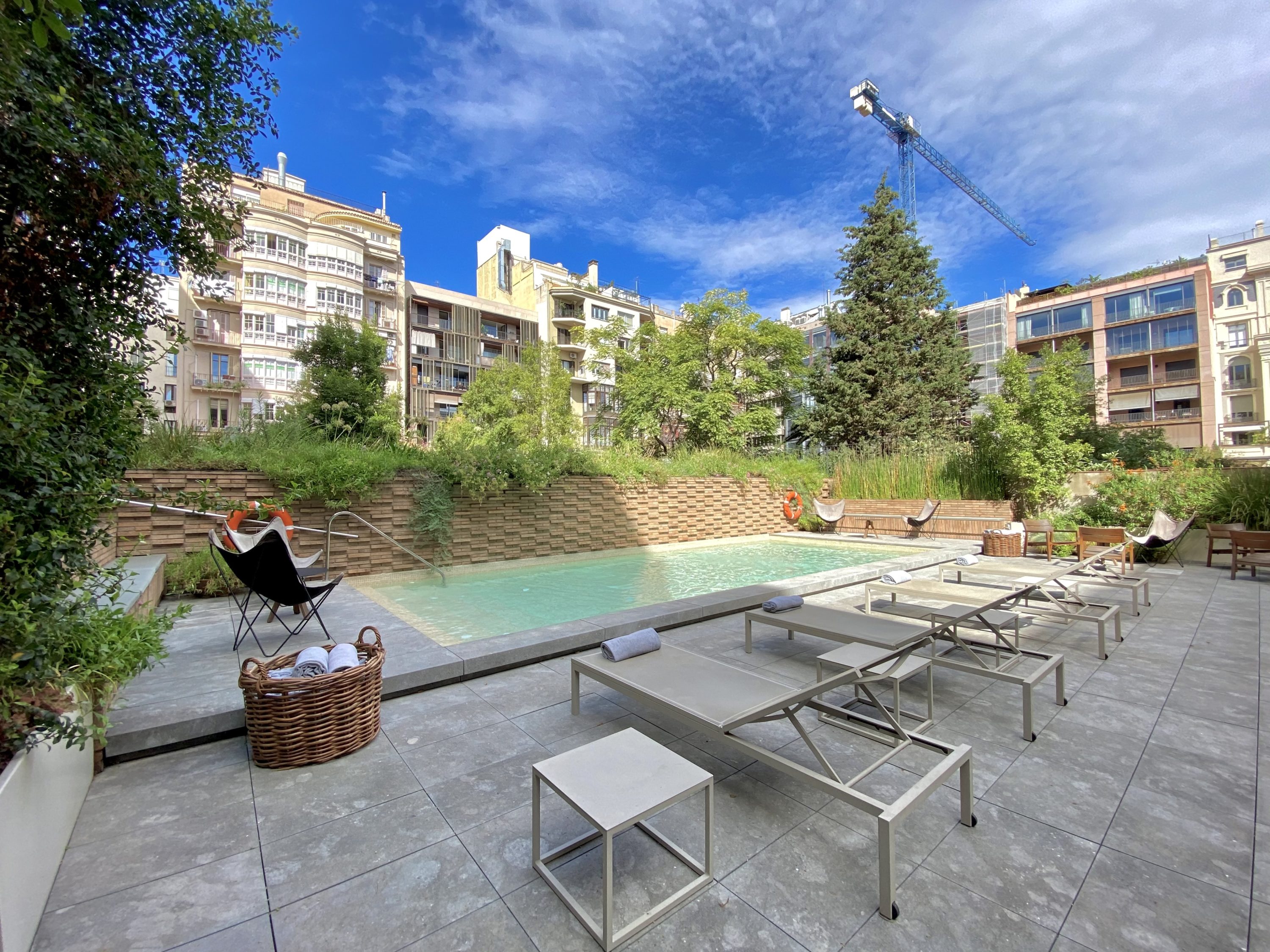 Alexandra Hotel Barcelona Curio Collection by Hilton poolside sunloungers Alexandra Hotel Barcelona Curio Collection by Hilton poolside sunloungers