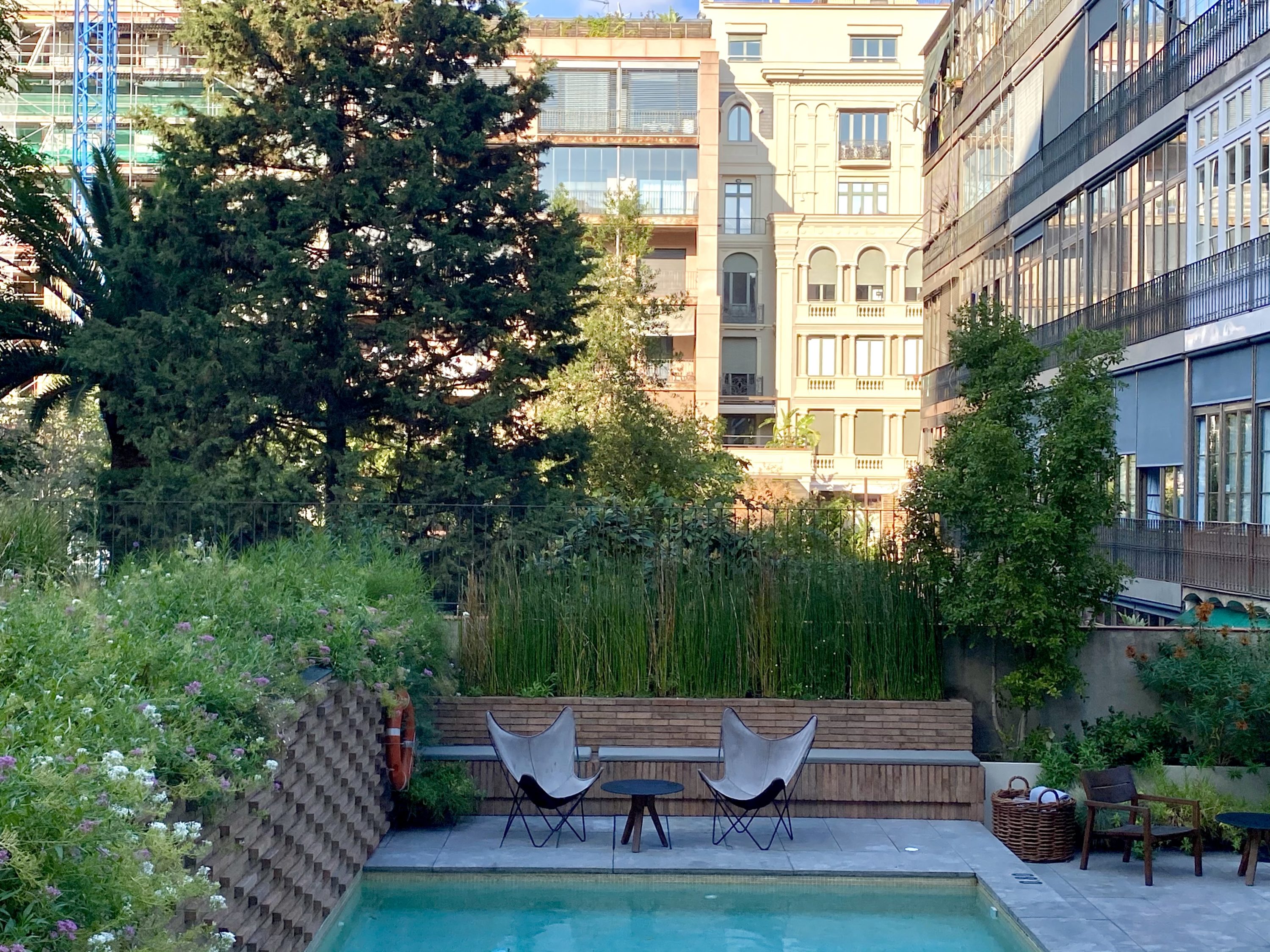 Alexandra Hotel Barcelona Curio Collection by Hilton poolside with courtyard view
