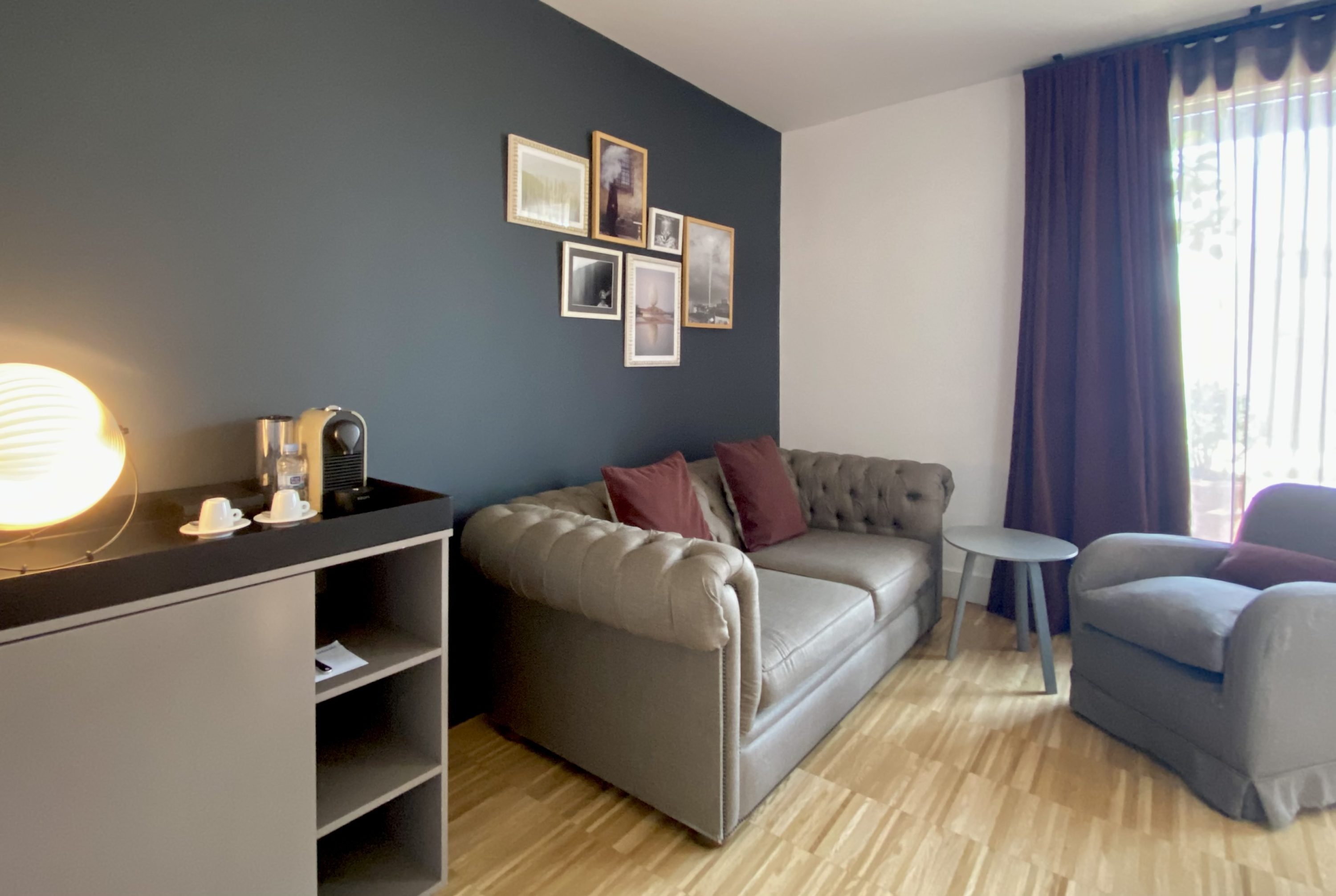 Alexandra Hotel Barcelona Curio Collection by Hilton seating area in King Junior Suite with Terrace