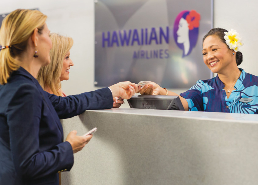 Hawaiian Airlines customers check in gate