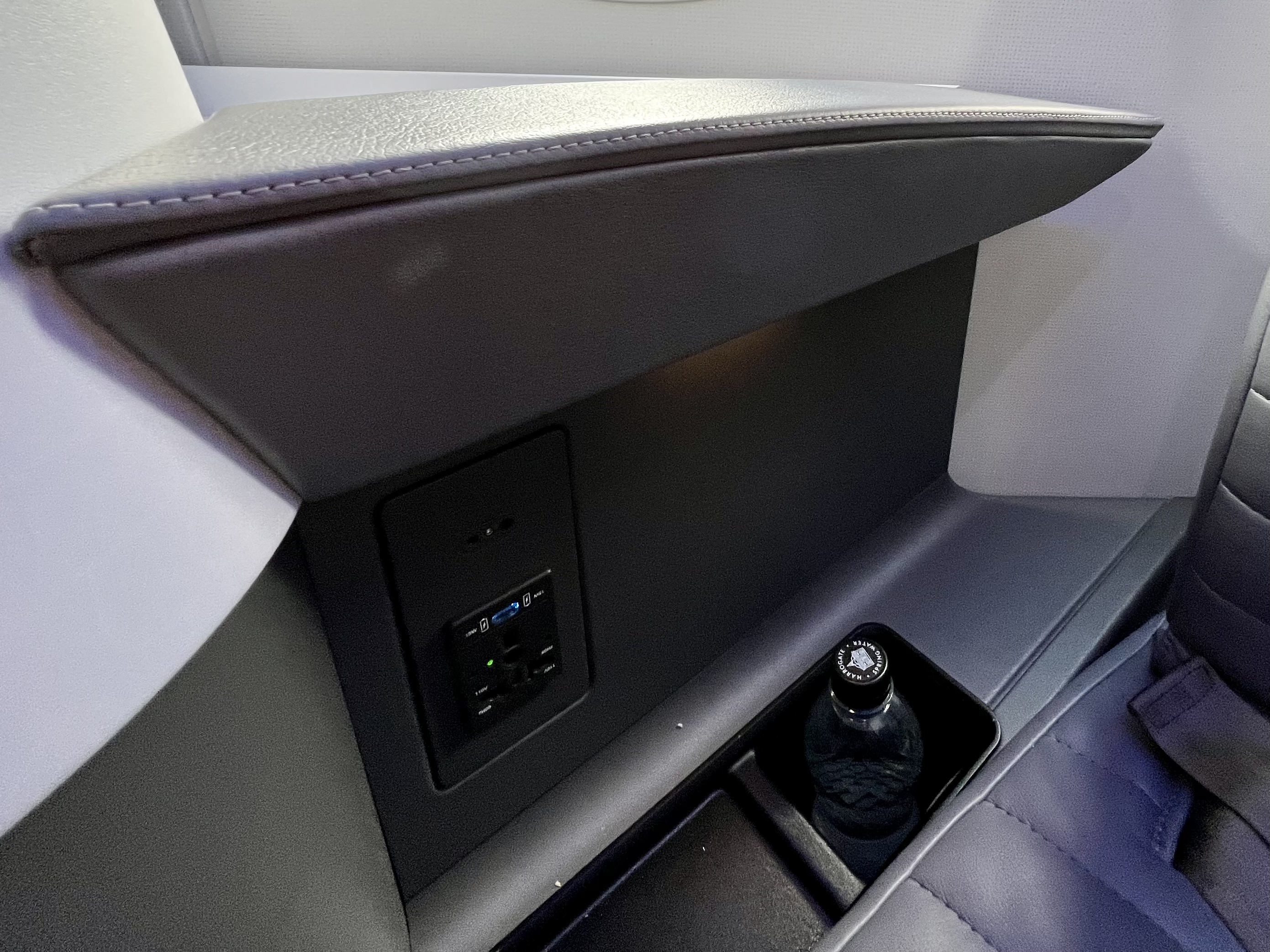 JetBlue Mint A321LR seat water storage and power outlet