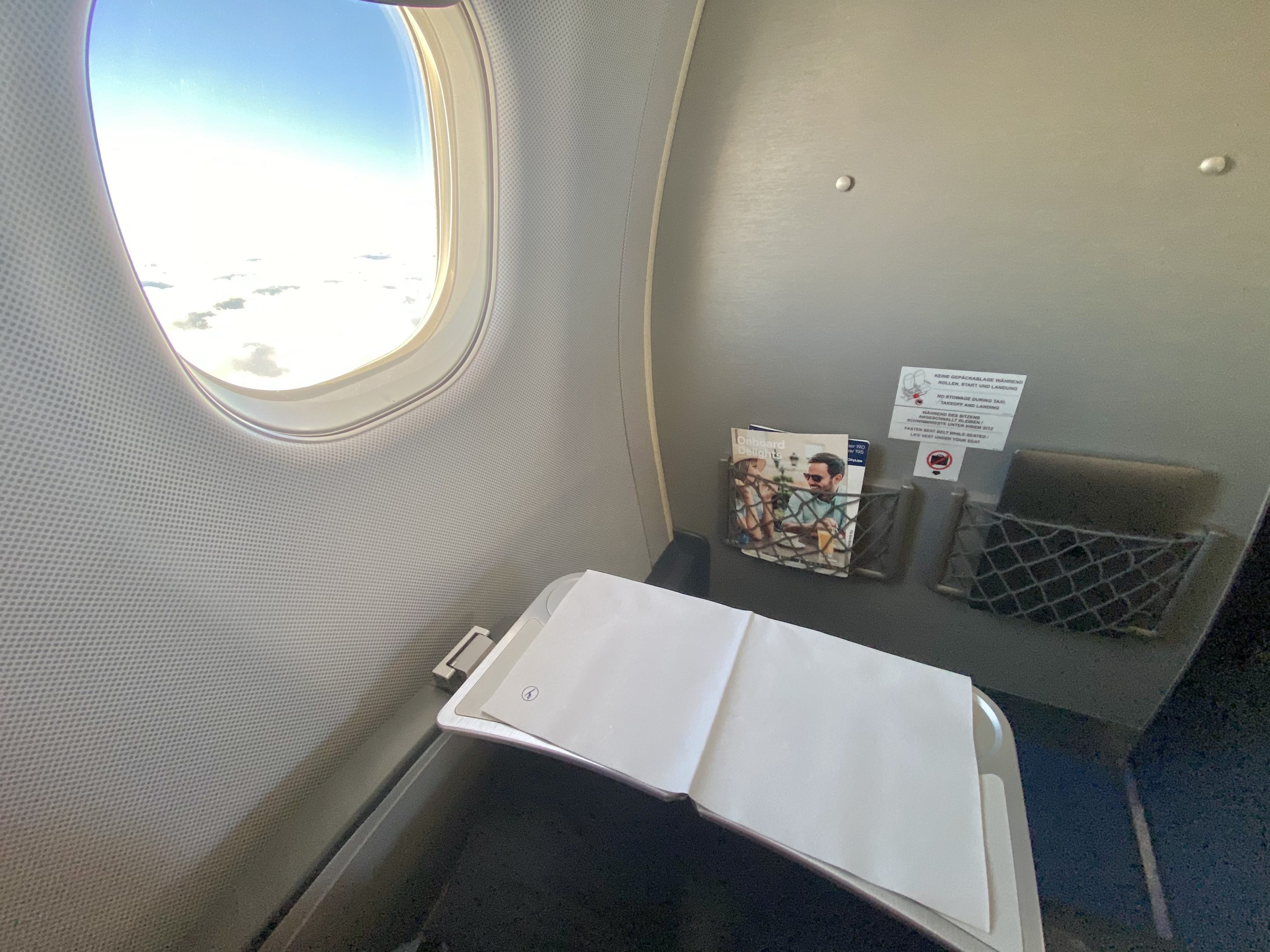 Lufthansa European business class Embraer E190 tray table set up