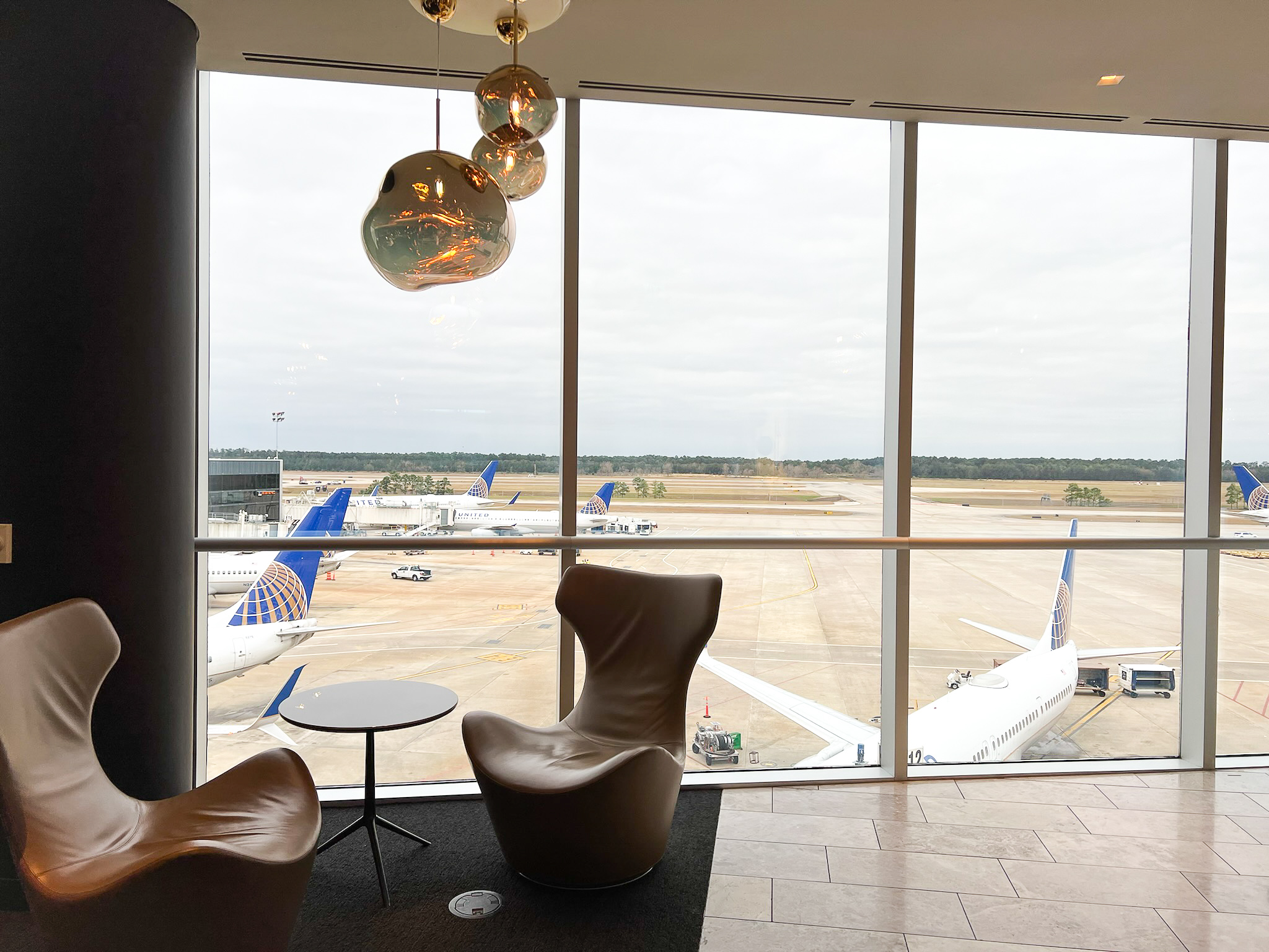 SFO United Polaris Lounge United Polaris Lounge Houston IAH chair with tarmac view