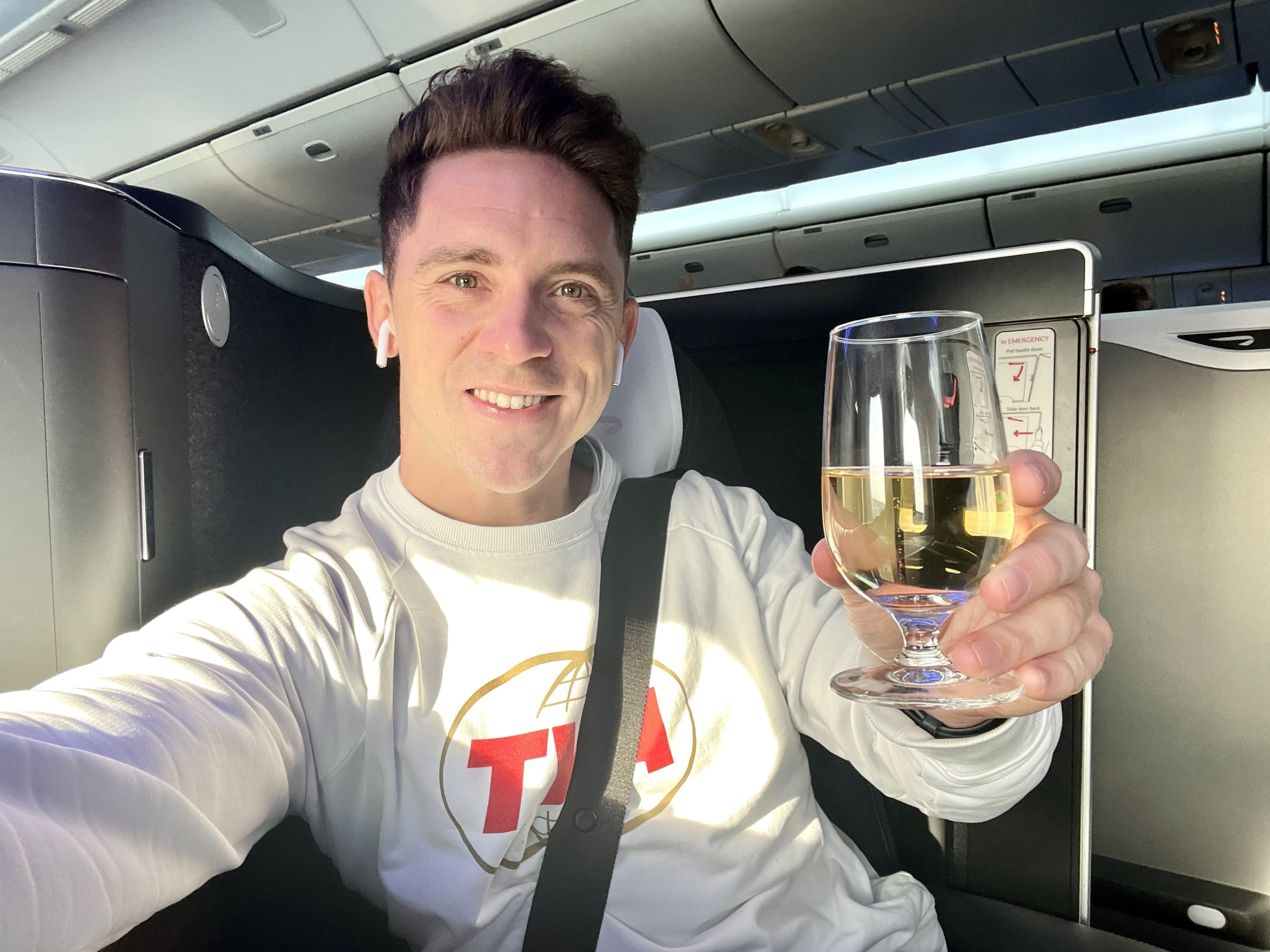 British Airways Boeing 777 300 Club Suite welcome drink cheers