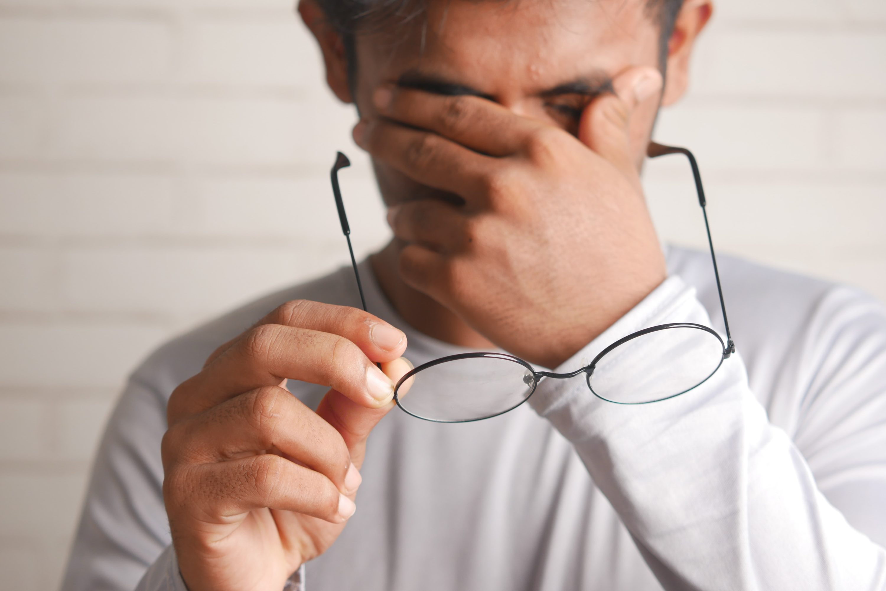 Frustration Frustrated man removing glasses