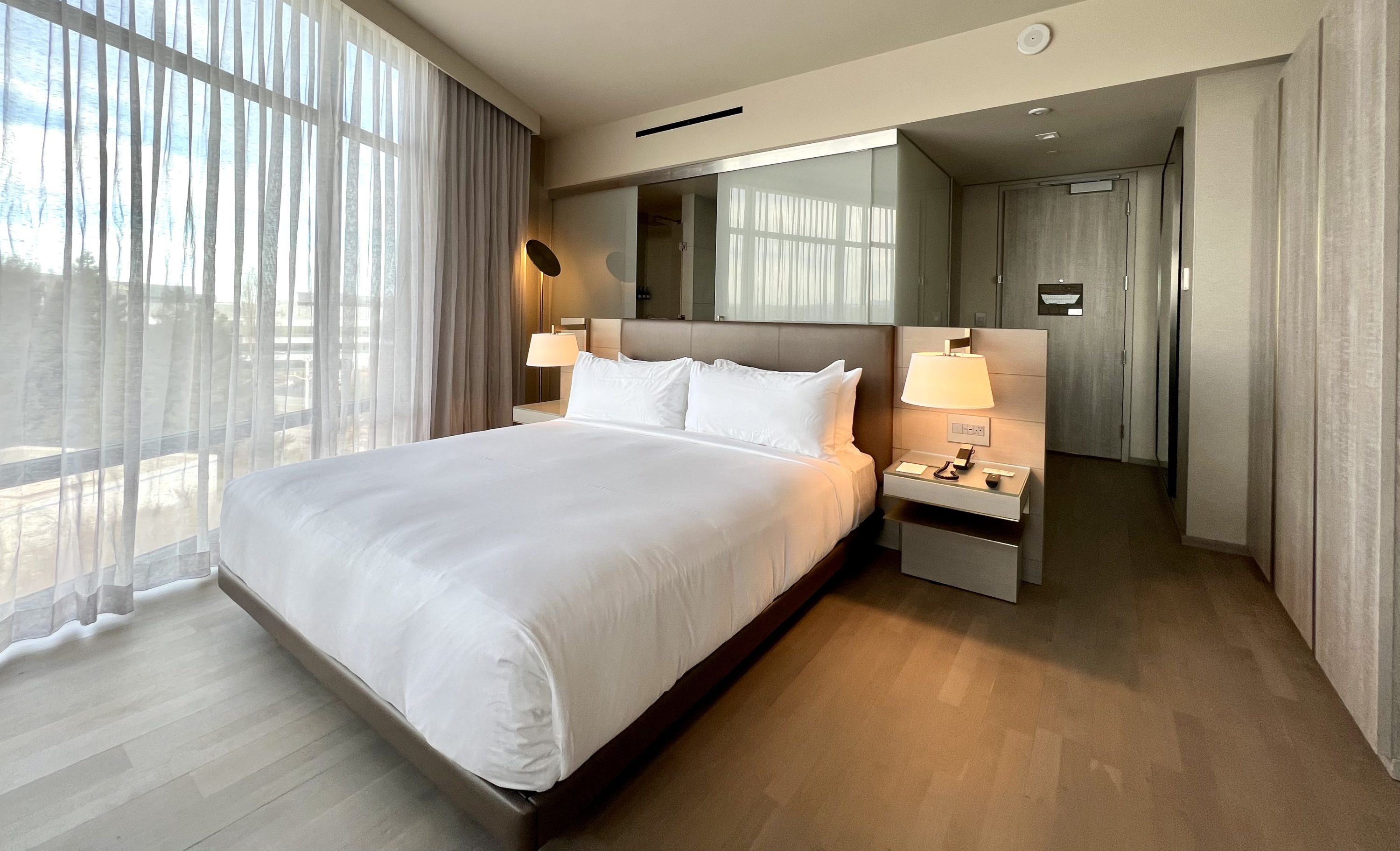 TETRA Hotel Autograph Collection room 504 living space bed