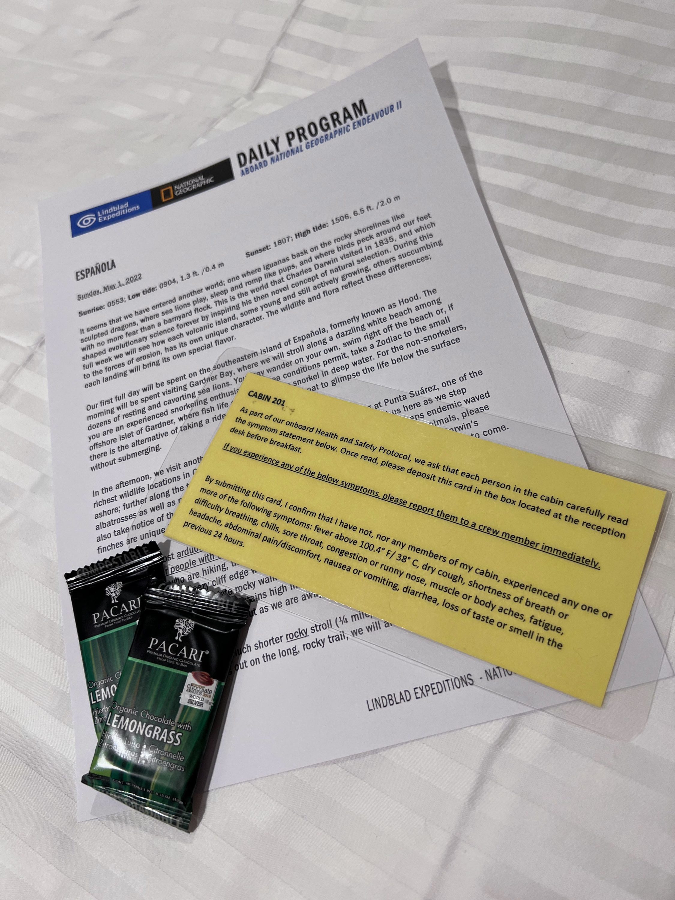 Daily program and chocolates from housekeeping on Endeavour II