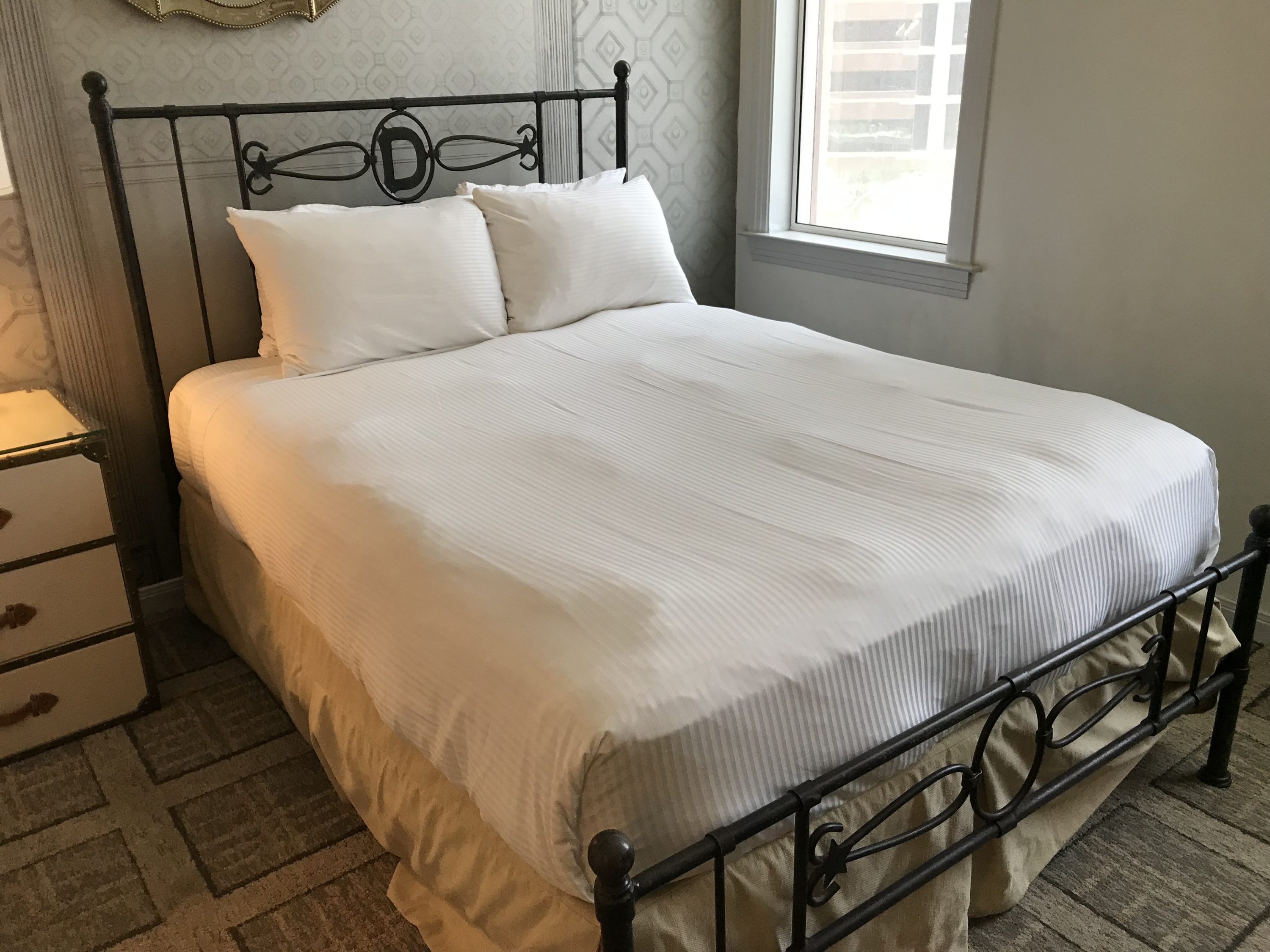 Bed close to the window at The Driskill Hotel