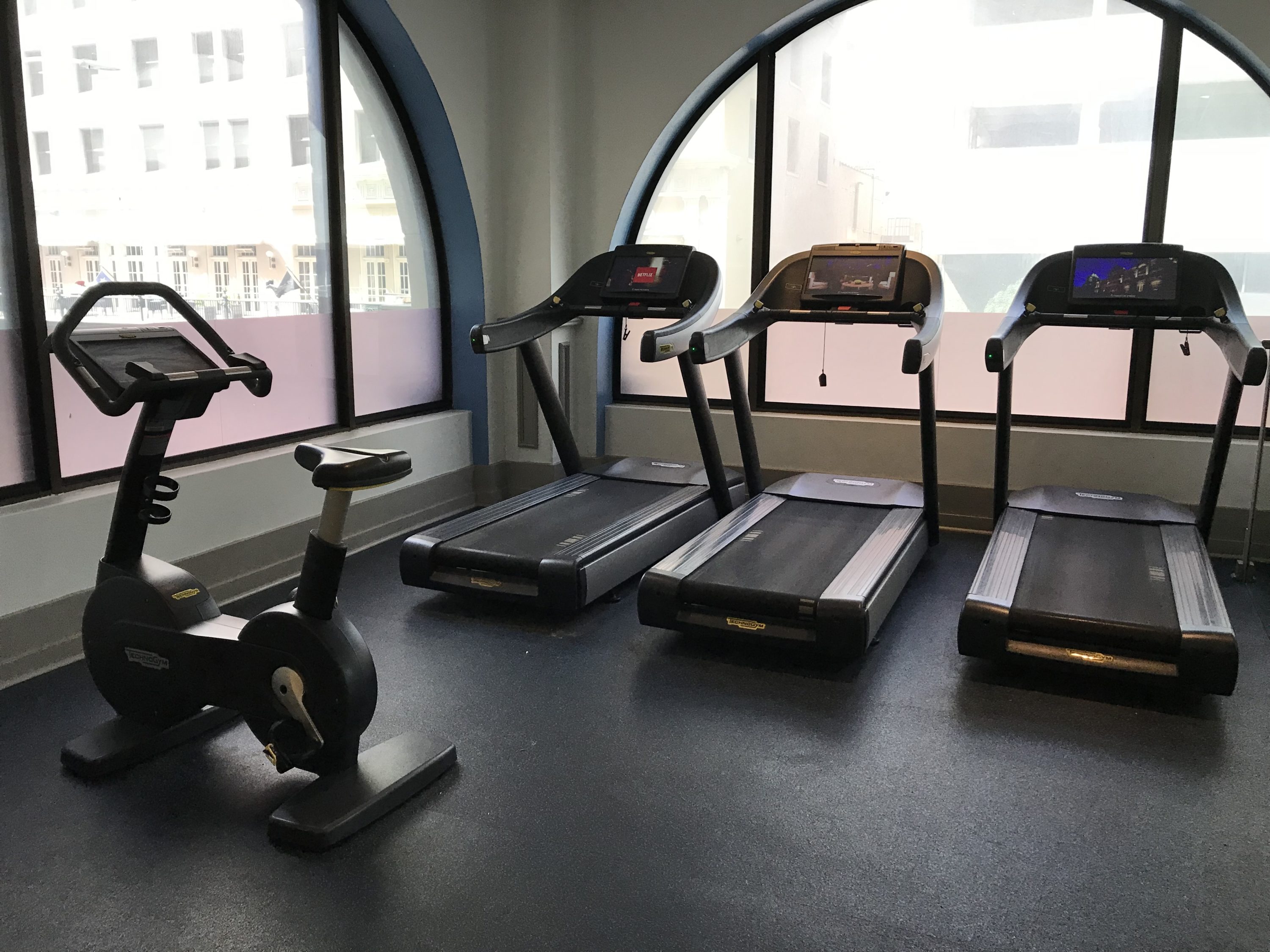 Treadmills and a stationary bike at The Driskill Hotel gym.