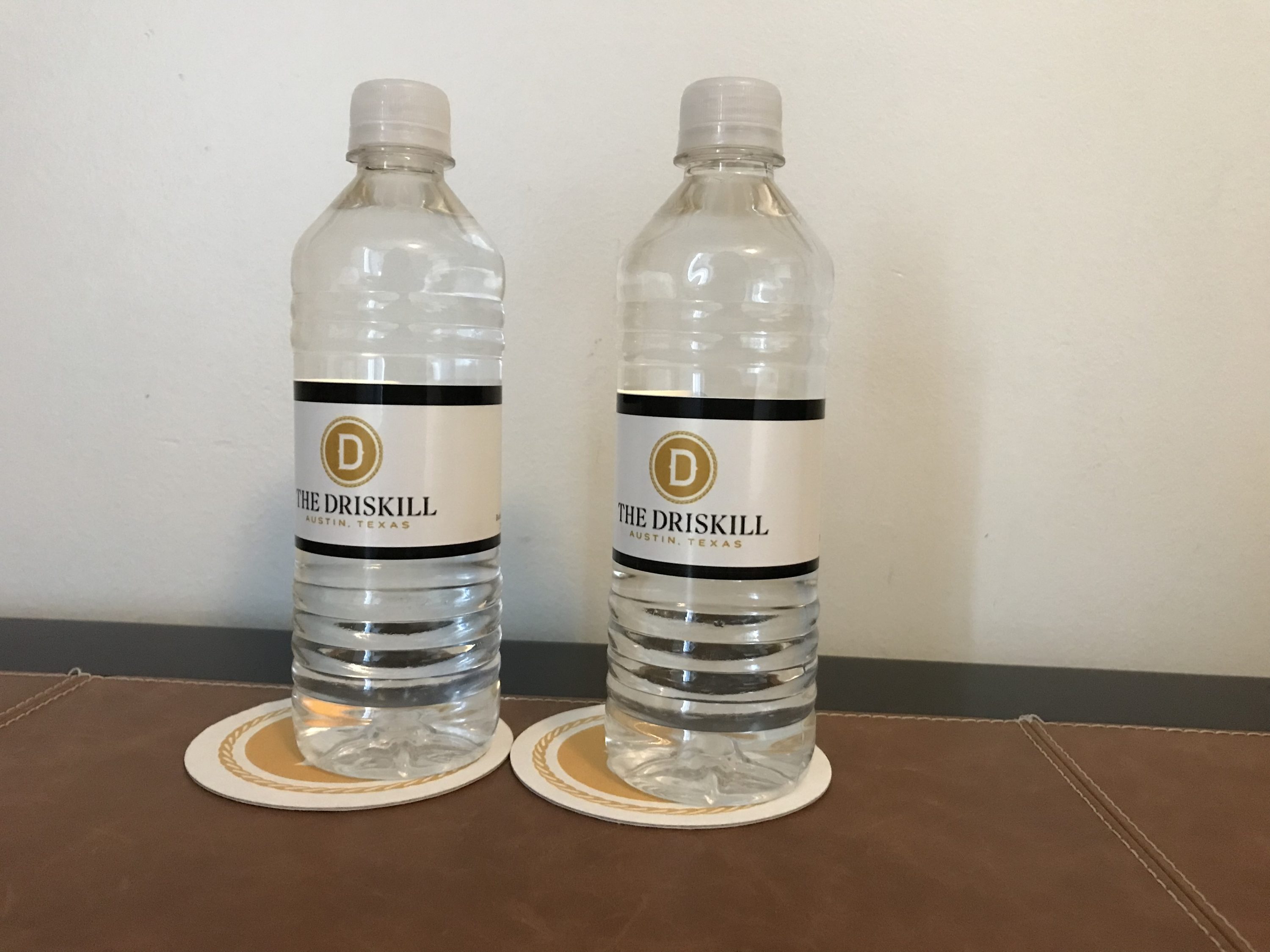 Free water bottles on the desk at The Driskill