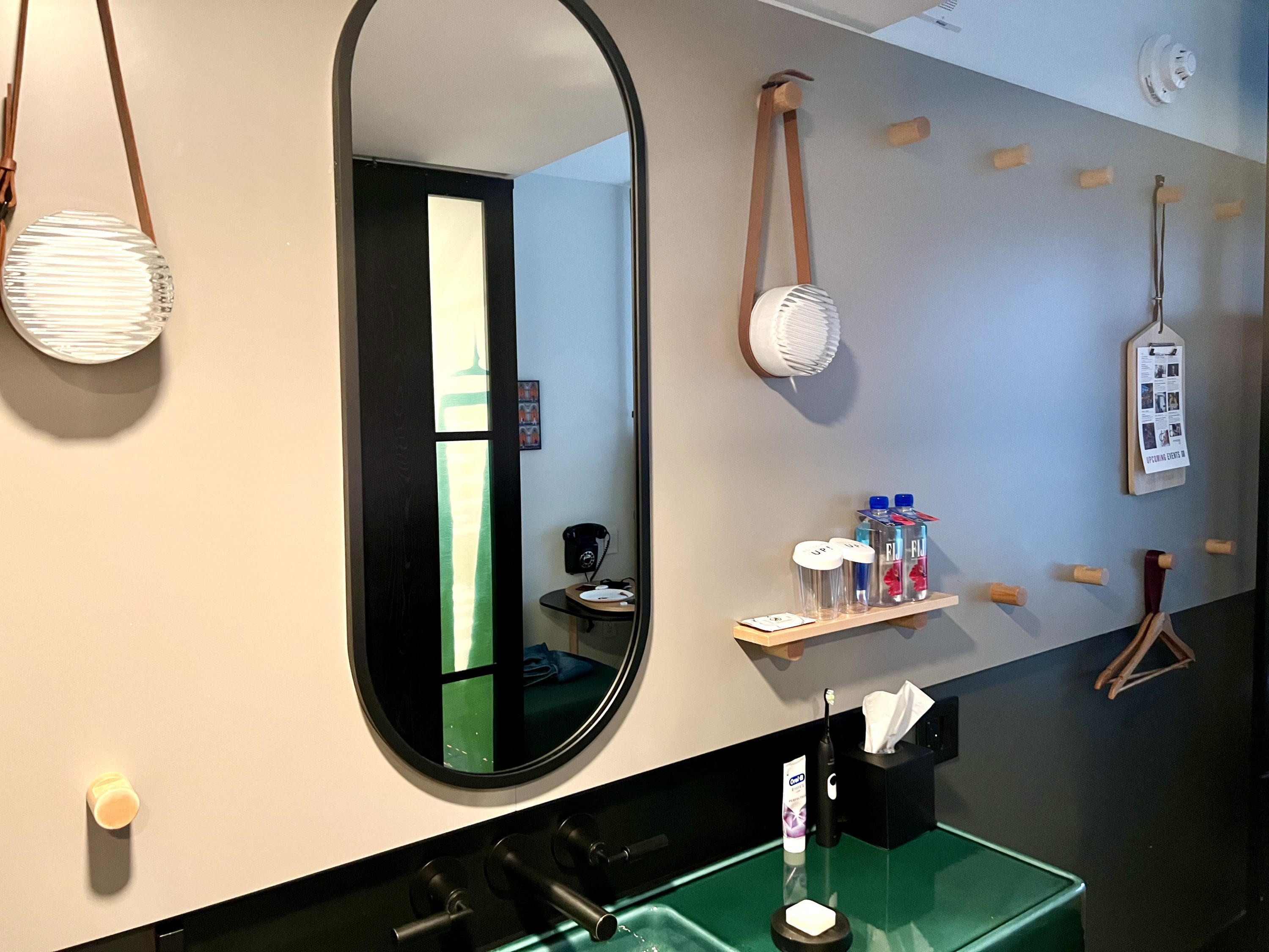 Moxy East Village bedroom sink and wall hangings