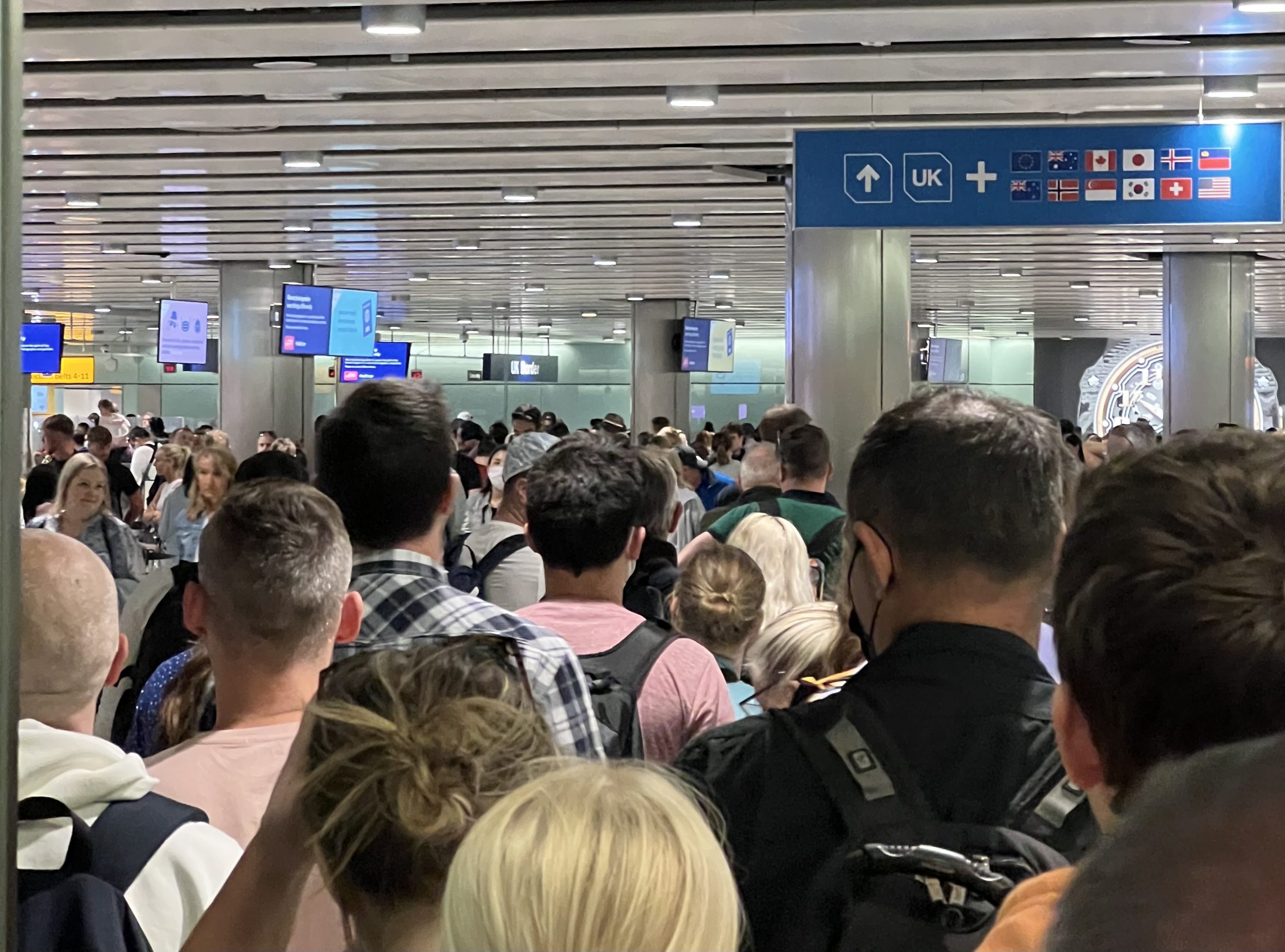 Passengers queuing to clear passport control at Heathrow's Terminal 3