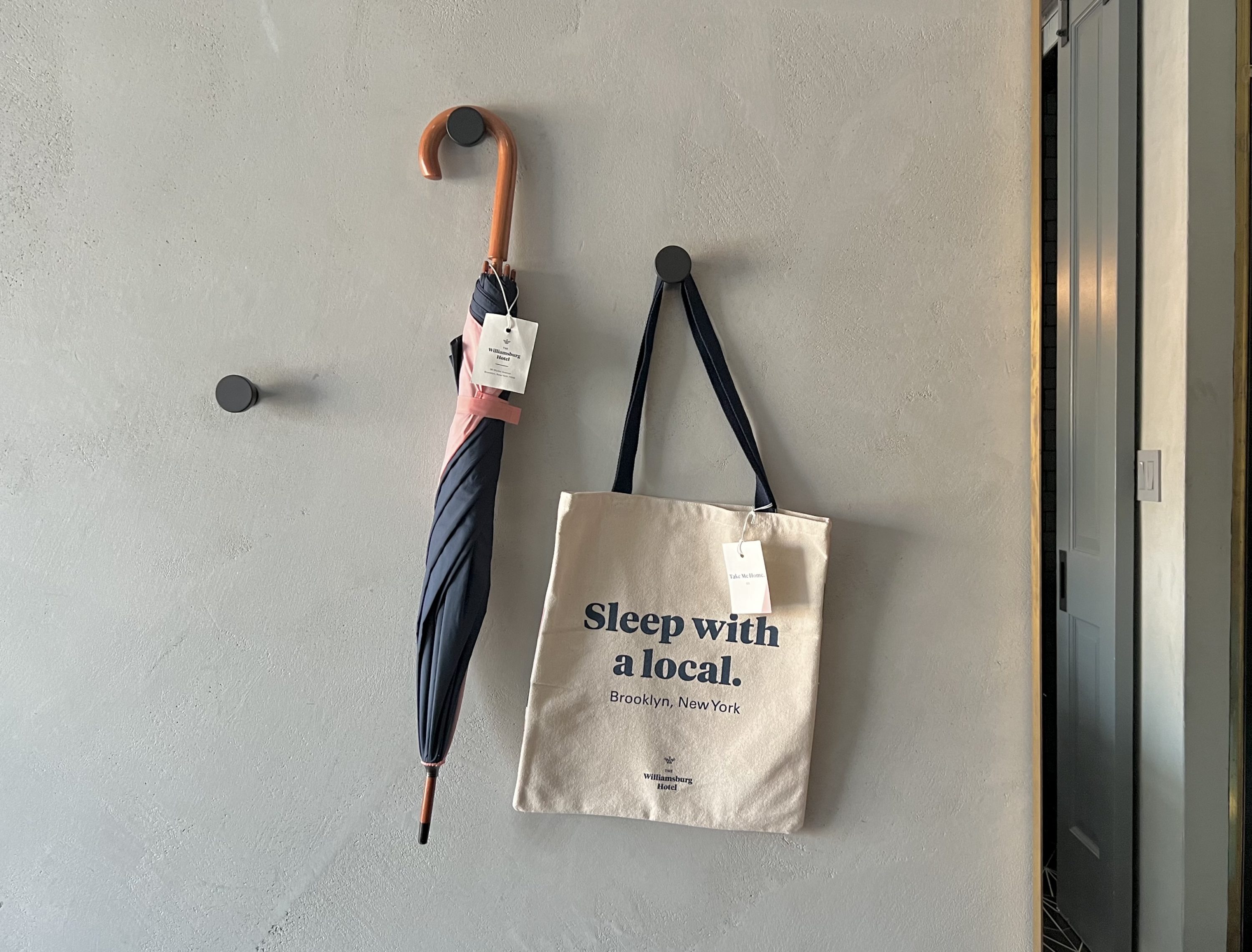 The Williamsburg Hotel bedroom umbrella and tote bag
