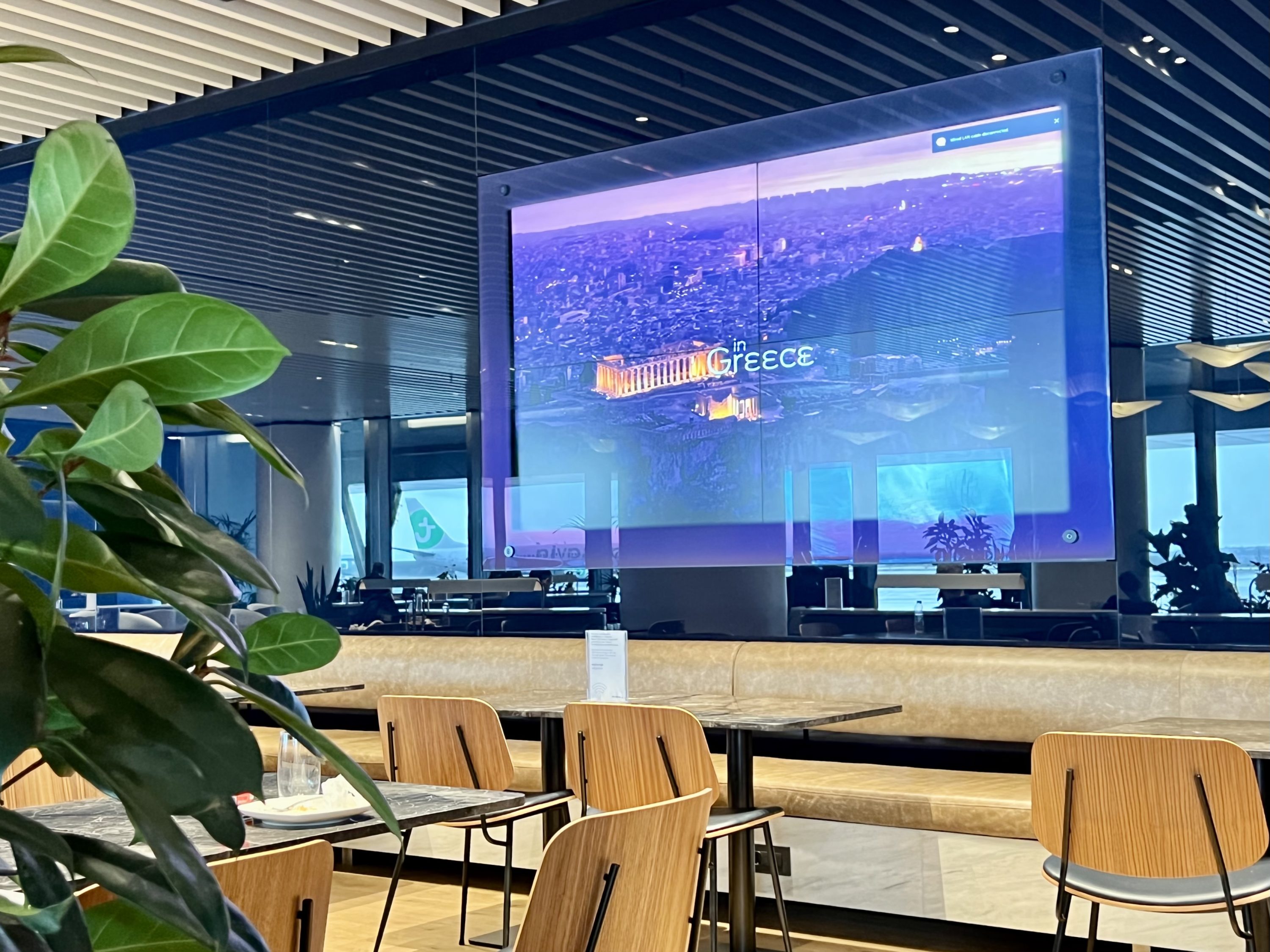 Aegean upgrade bid Aegean Lounge big screen