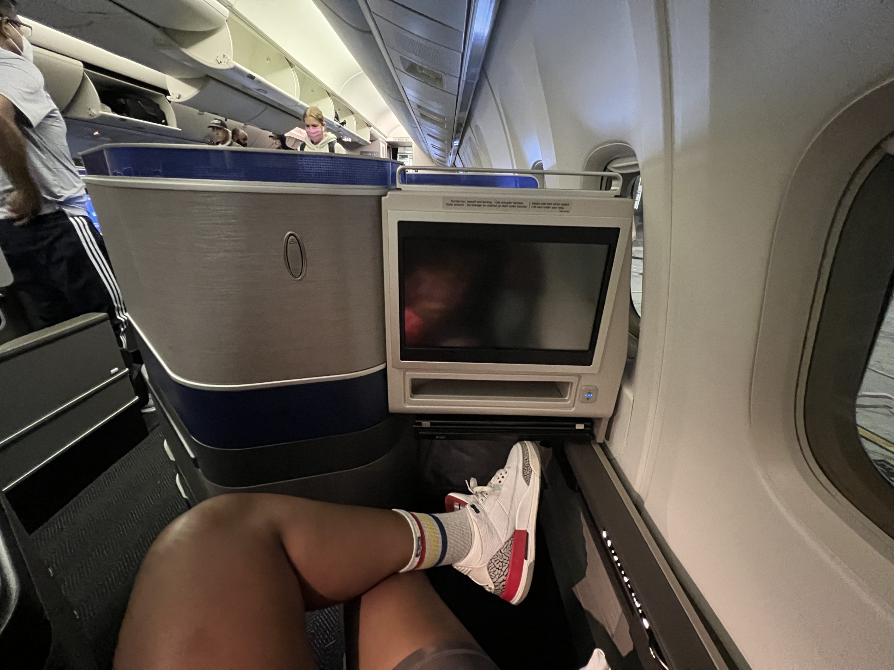 United Polaris business class legroom and IFE screen