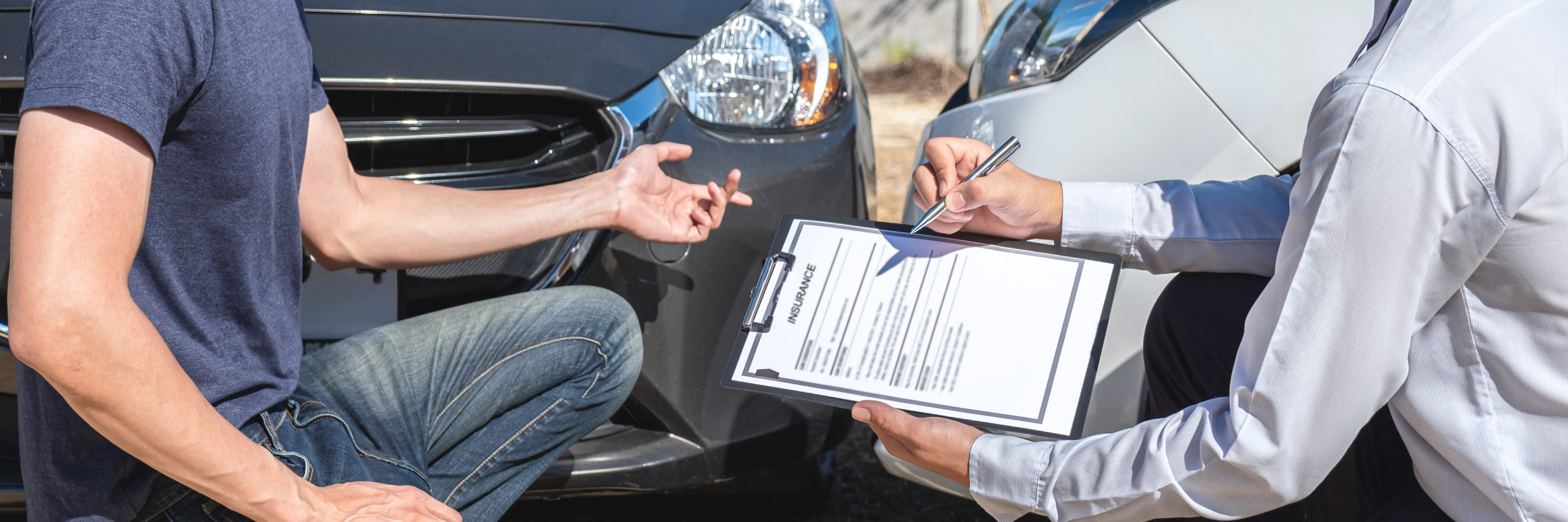 Insurance agent examine the damage of the car after accident on report claim form process