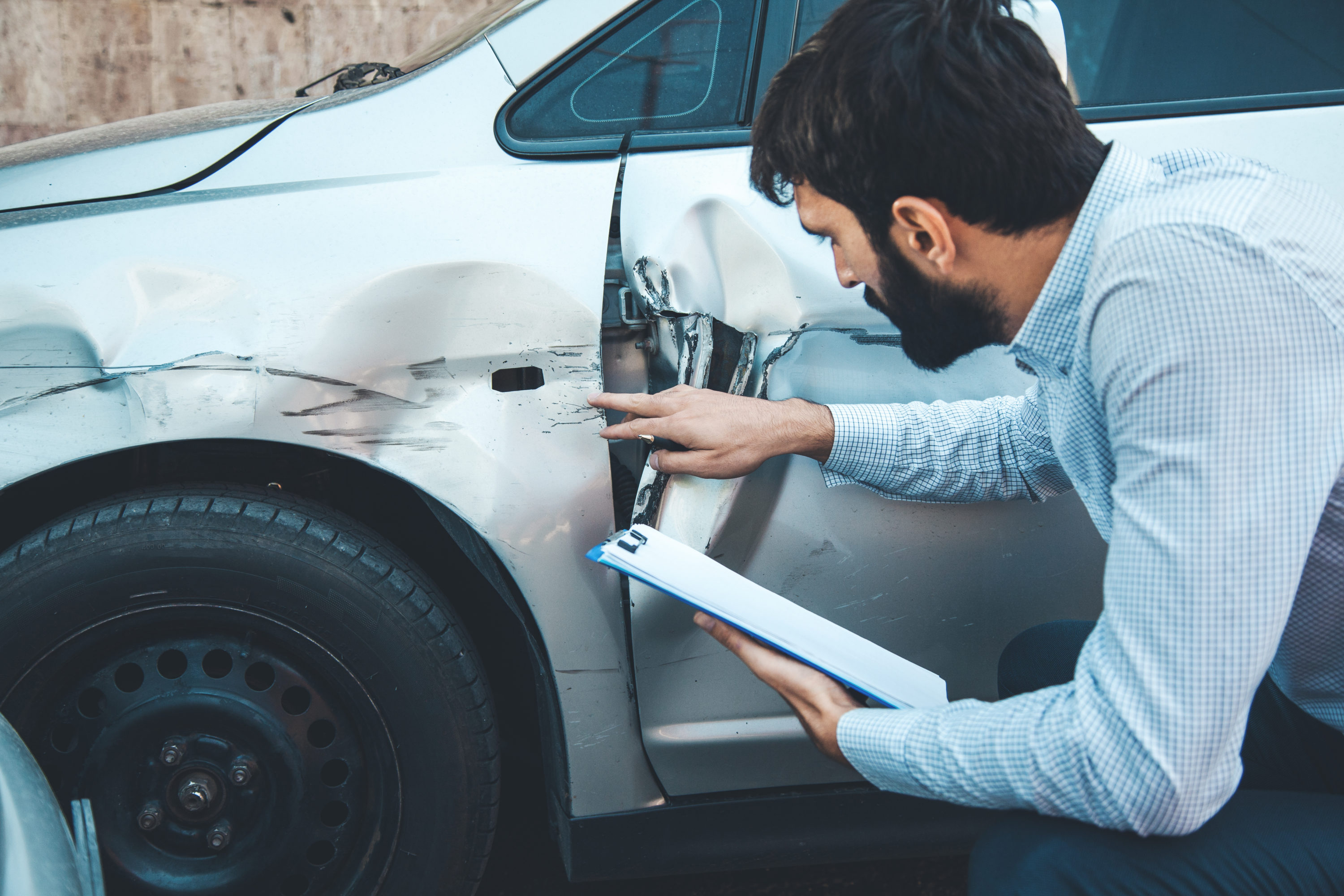 Man documenting car crash accident Man documenting car crash accident