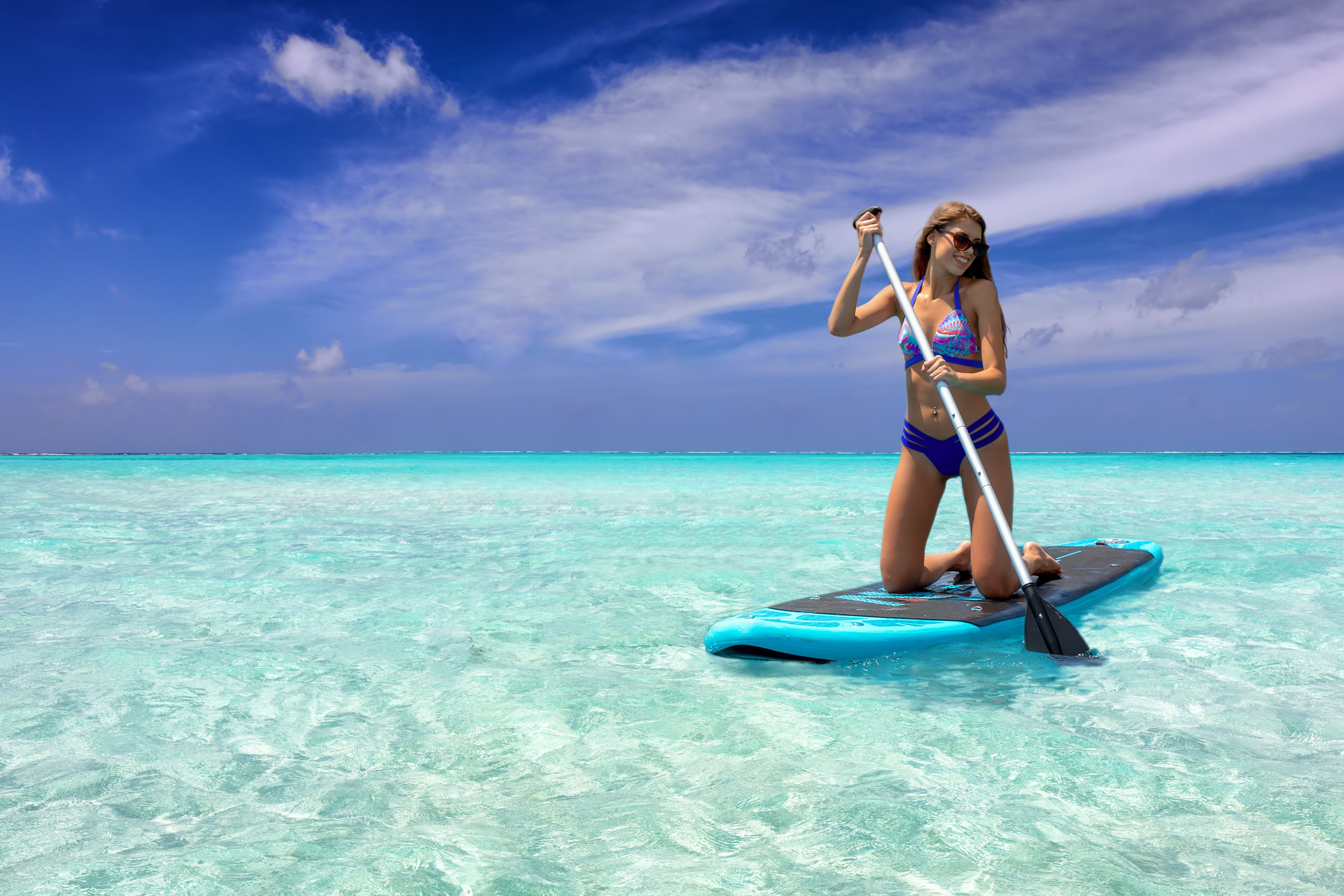 Paddle board in Maldives