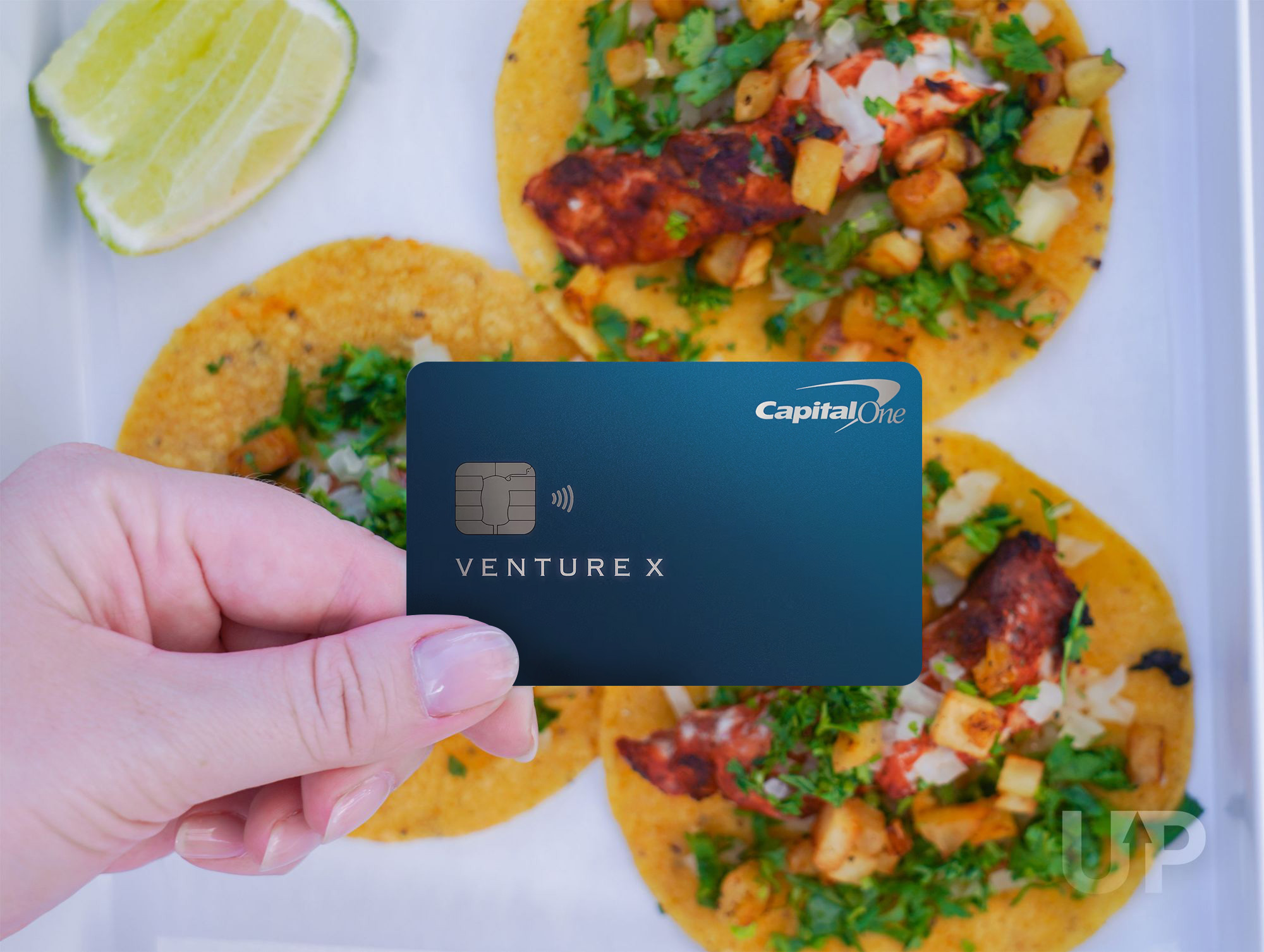 Woman using card to shop online Capital One Venture X Upgraded Points LLC 11 Large