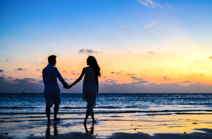 Couple walking on beach