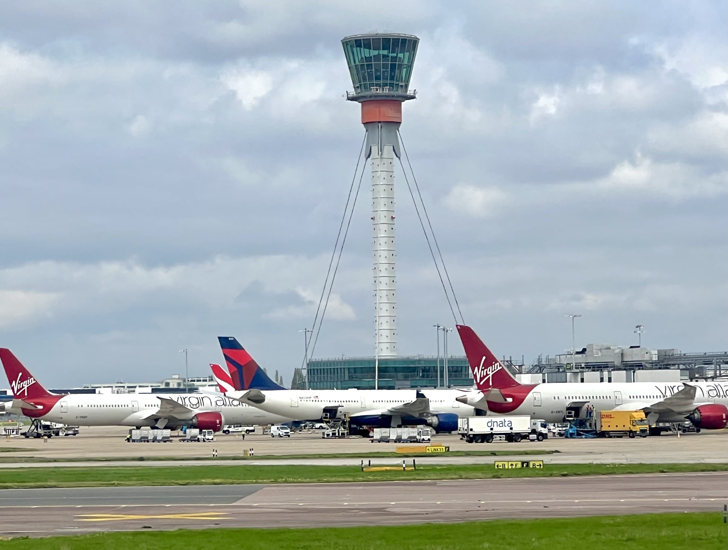 Virgin and Delta aircraft at London Heathrow Terminal 3