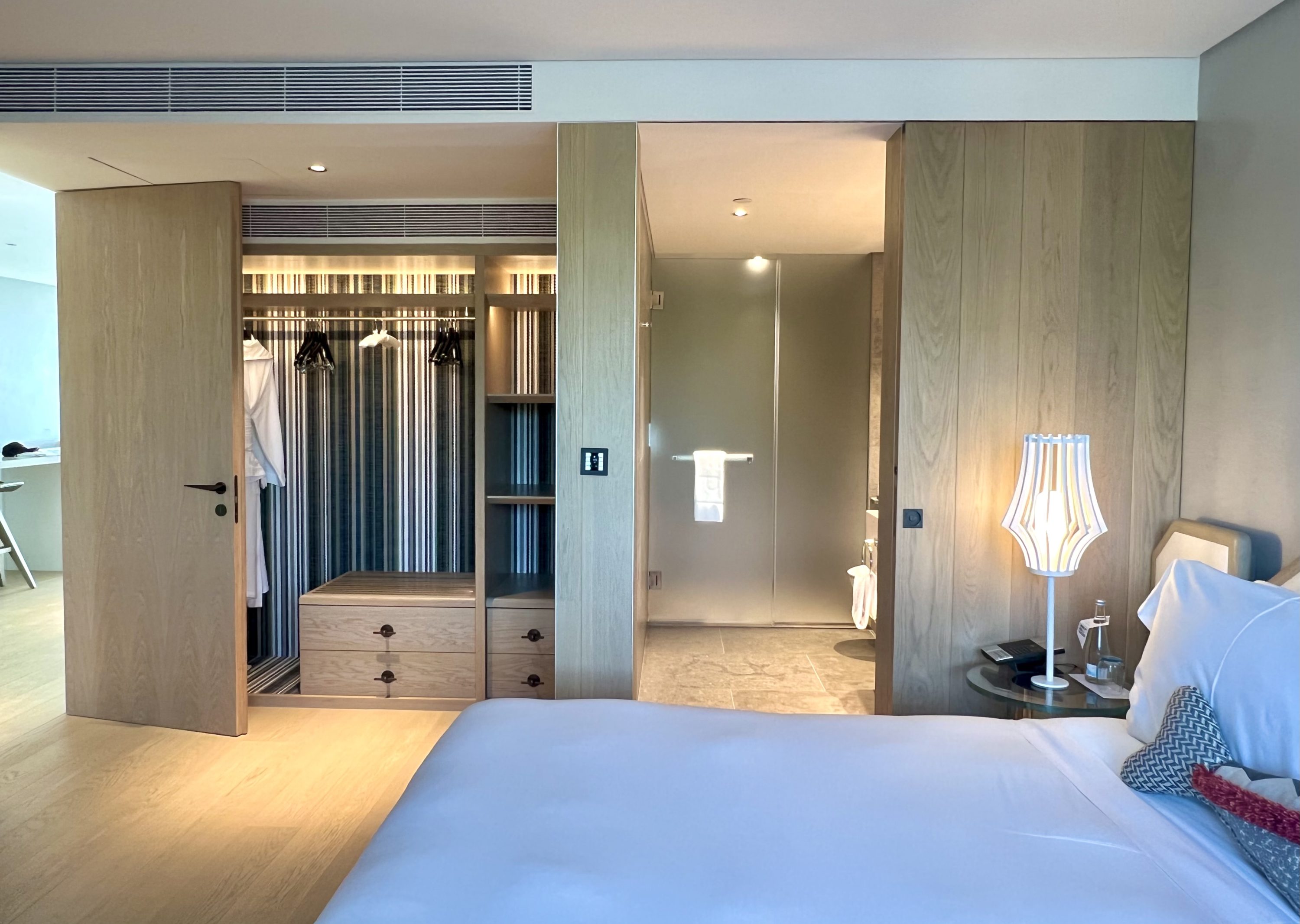 W Algarve Marvellous Residence guest room storage and view into bathroom