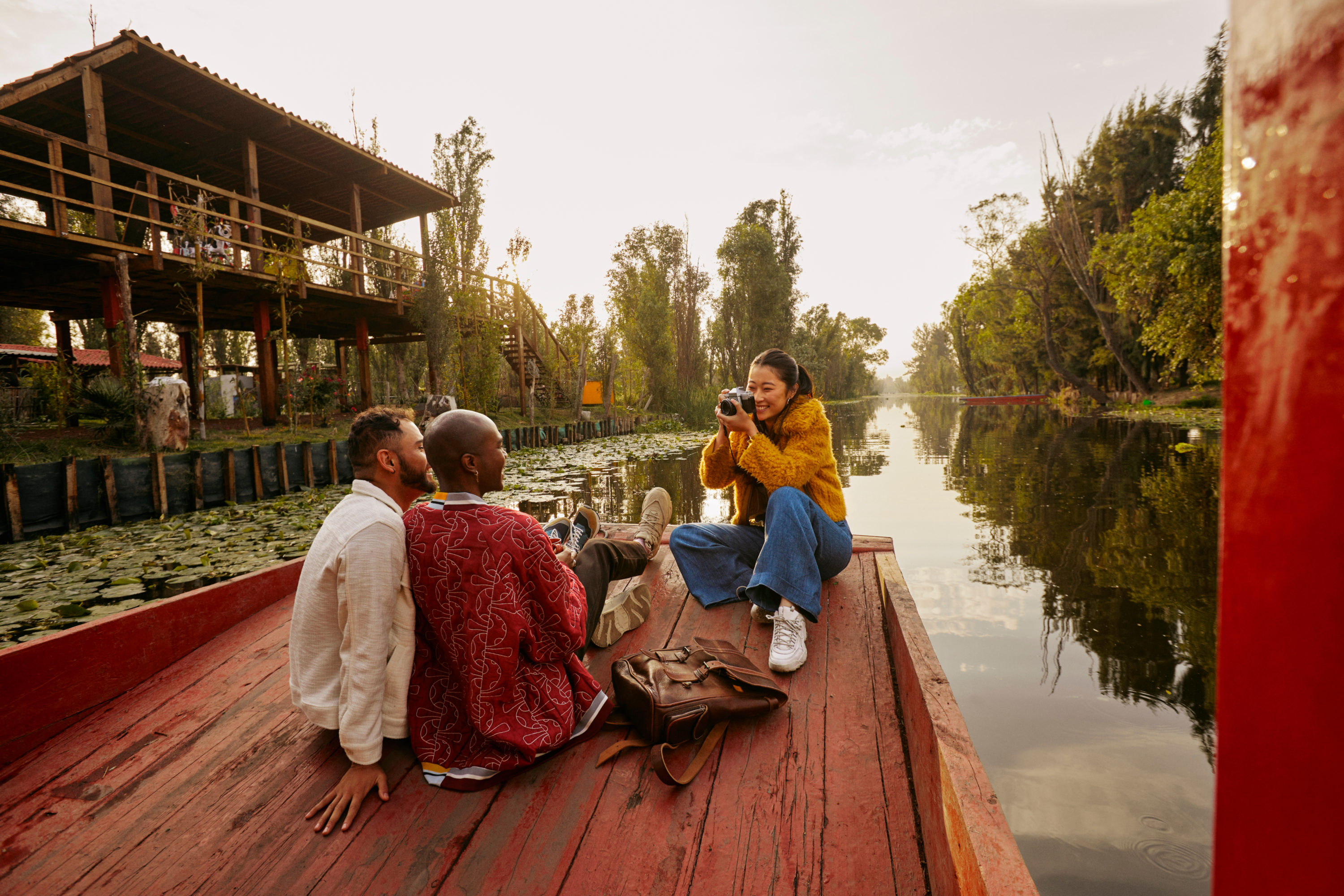 Woman takes picture of 2 men while on boat tour Woman takes picture of 2 men while on boat tour