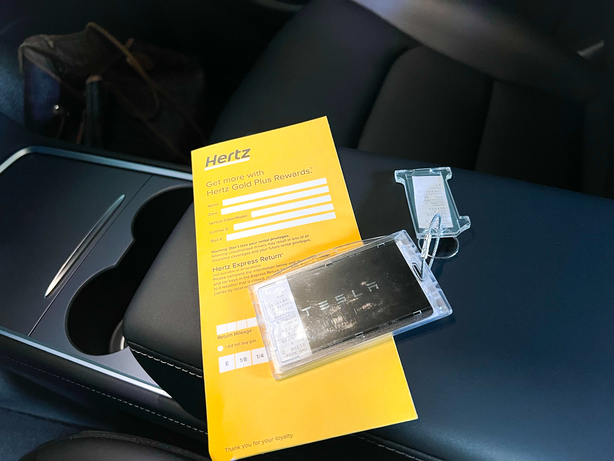 Hertz Tesla Model Y key and contract