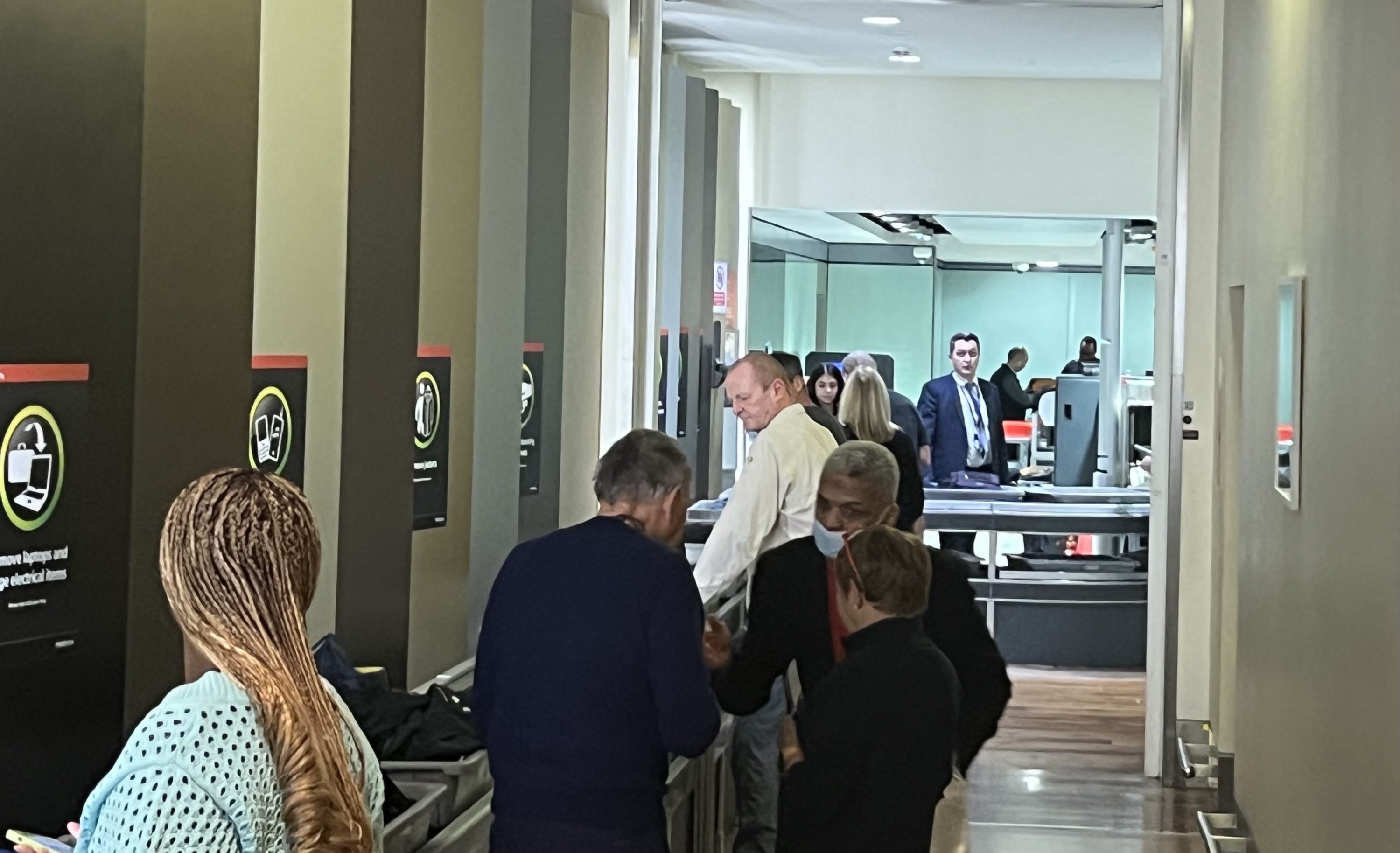 Waiting to pass through security at the Upper Wing at Heathrow Terminal 