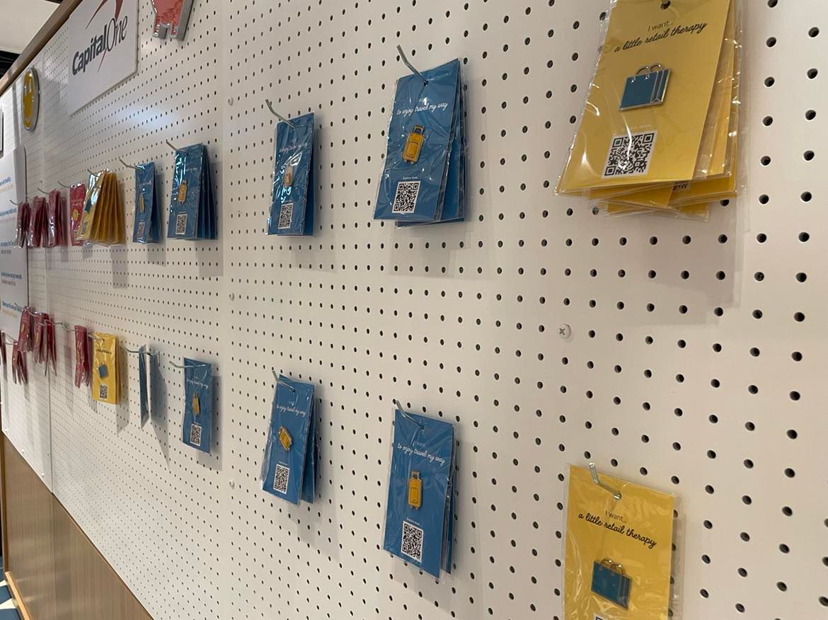 Closer look at the free product information pins at the Houston Galleria Capital One Café
