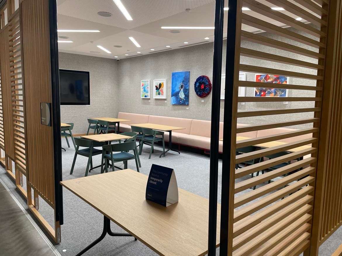 Interior view of the community room at the Houston Galleria Capital One Café