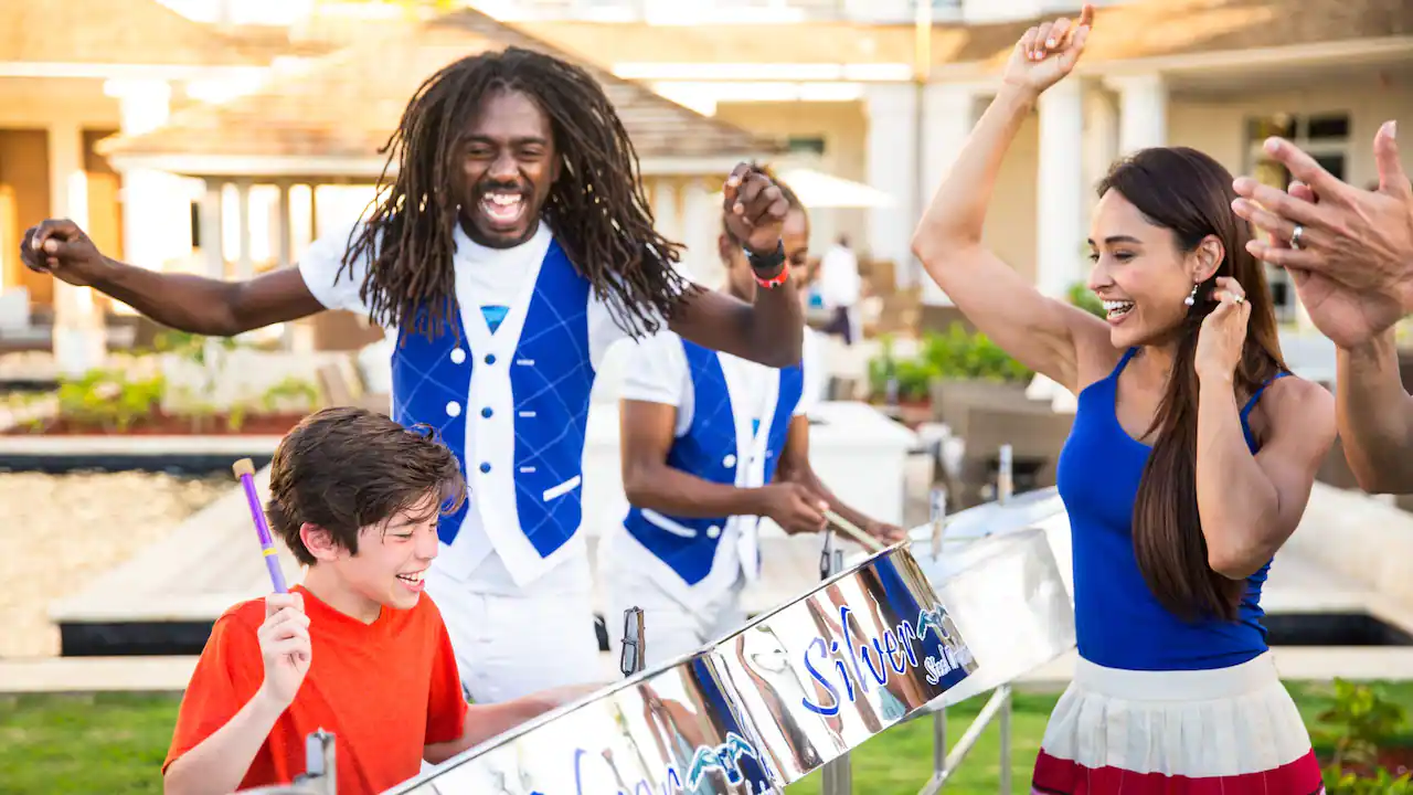 Family dancing and drumming to steel drum show at Hyatt Ziva Rose Hall