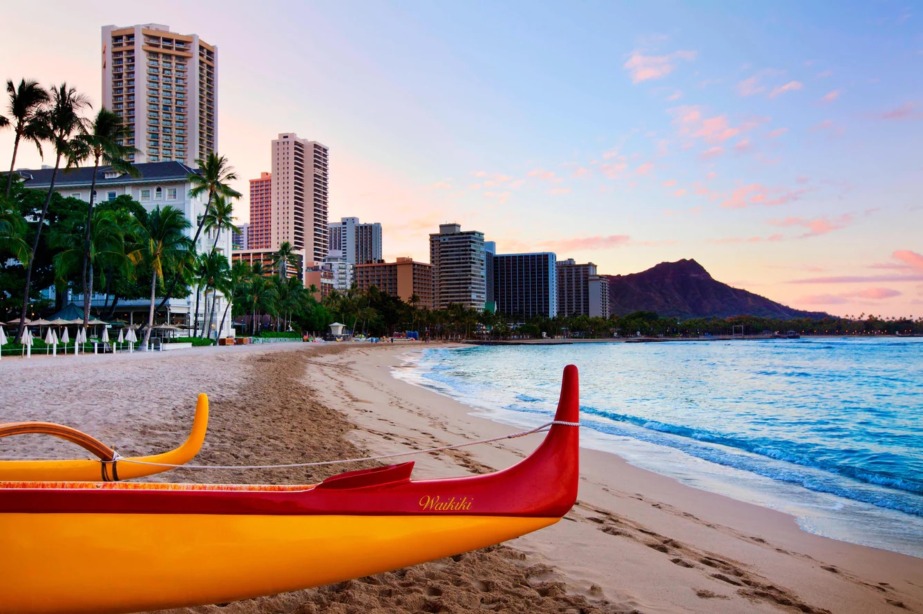 A red and yellow kayak on Waikiki Beach.