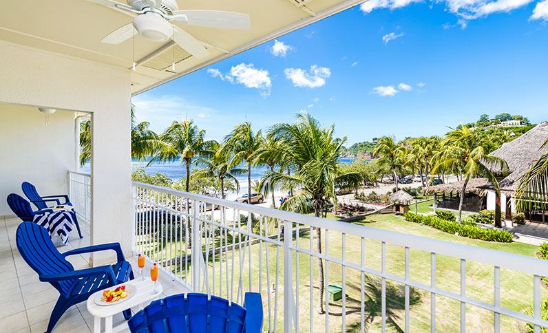 Balcony of a room at Margaritaville Costa Rica that has an ocean and resort view.