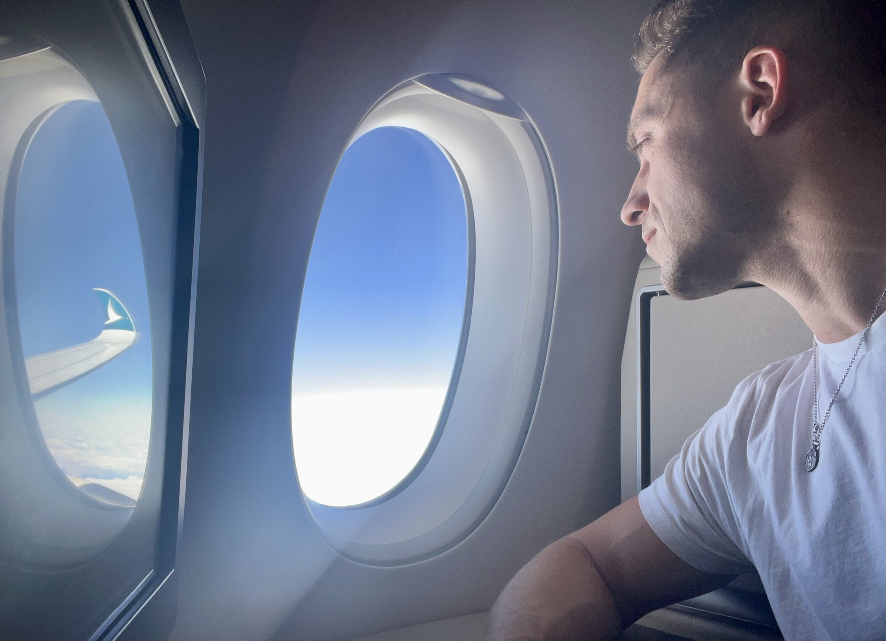 Cathay Pacific Airbus A35k business class reflecting
