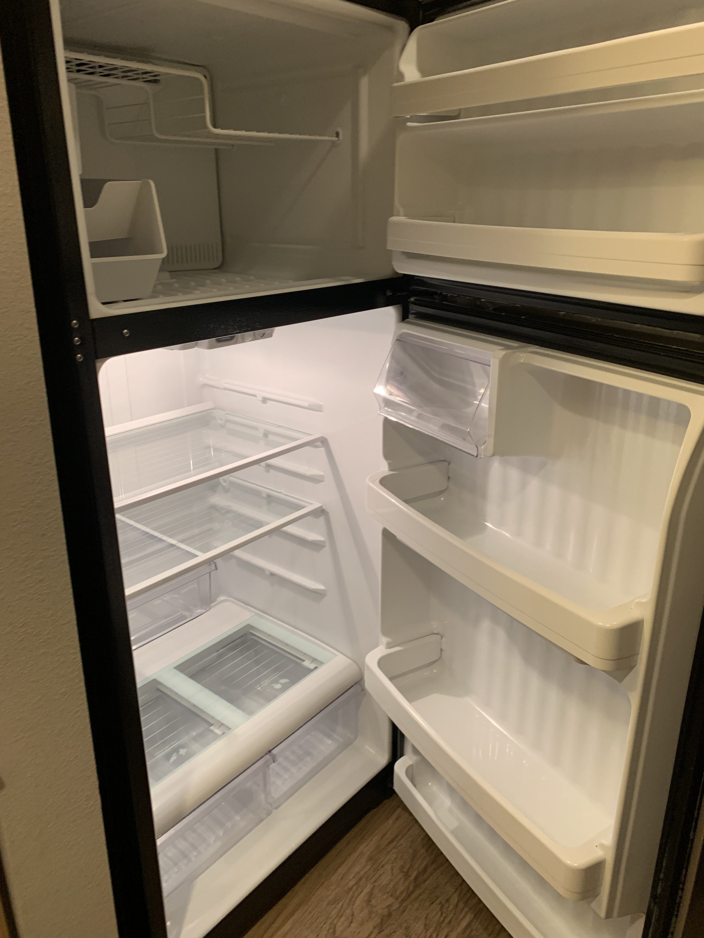 Refrigerator interior in the guestroom at Homewood Suites Austin Round Rock