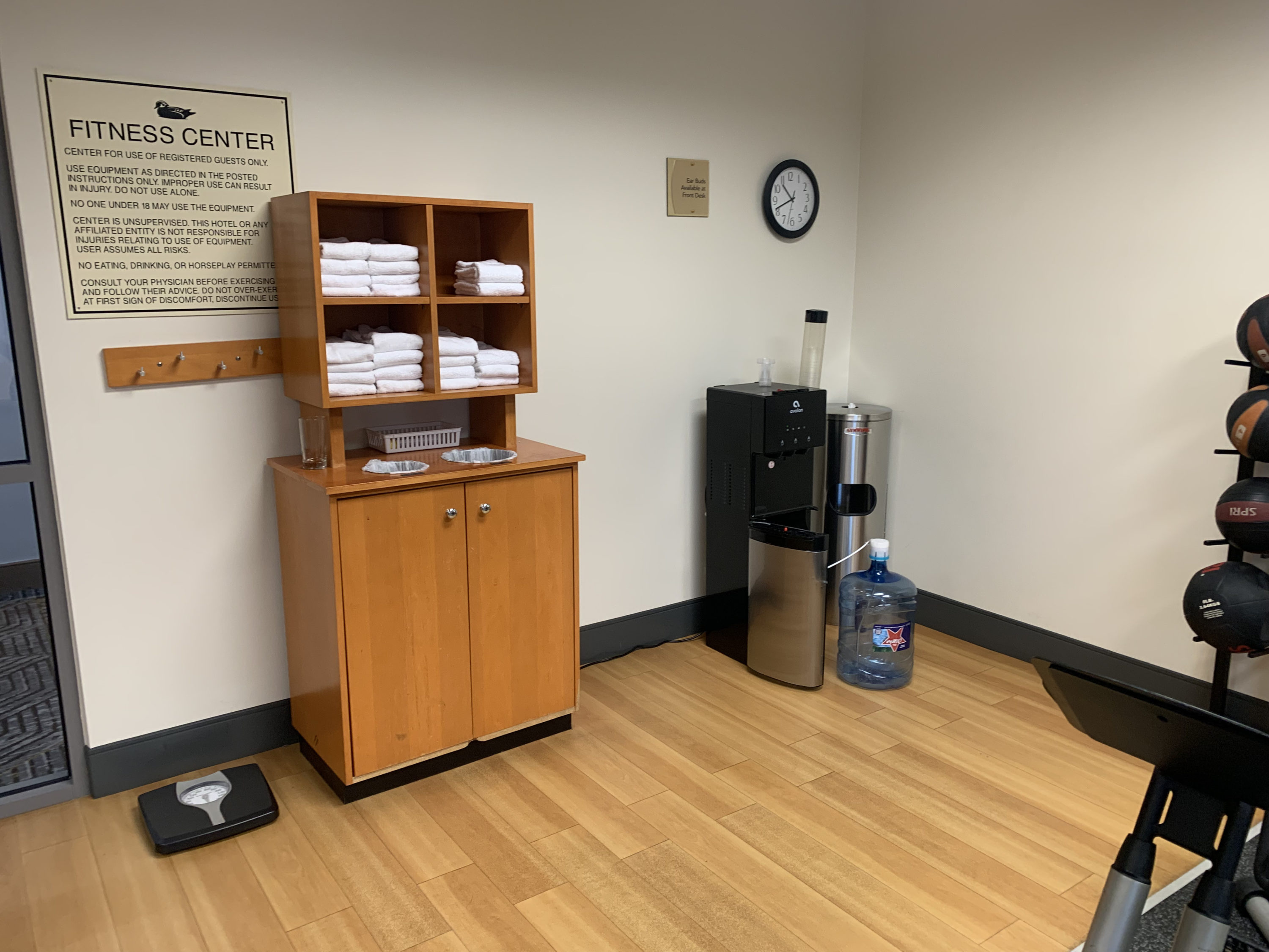 Towels and water in the fitness room at Homewood Suites Austin Round Rock