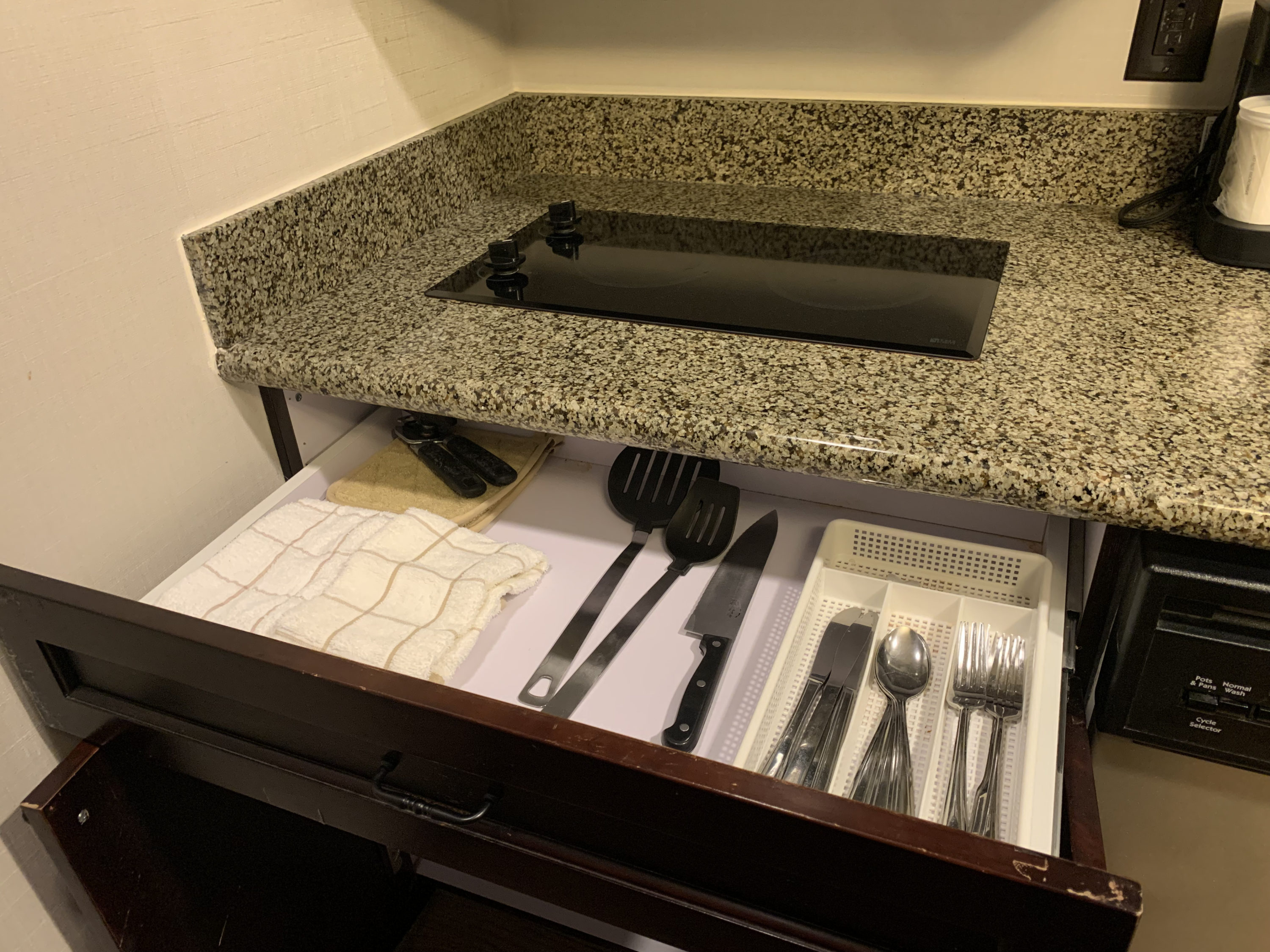 Utensils in the guestroom kitchen at Homewood Suites Austin Round Rock