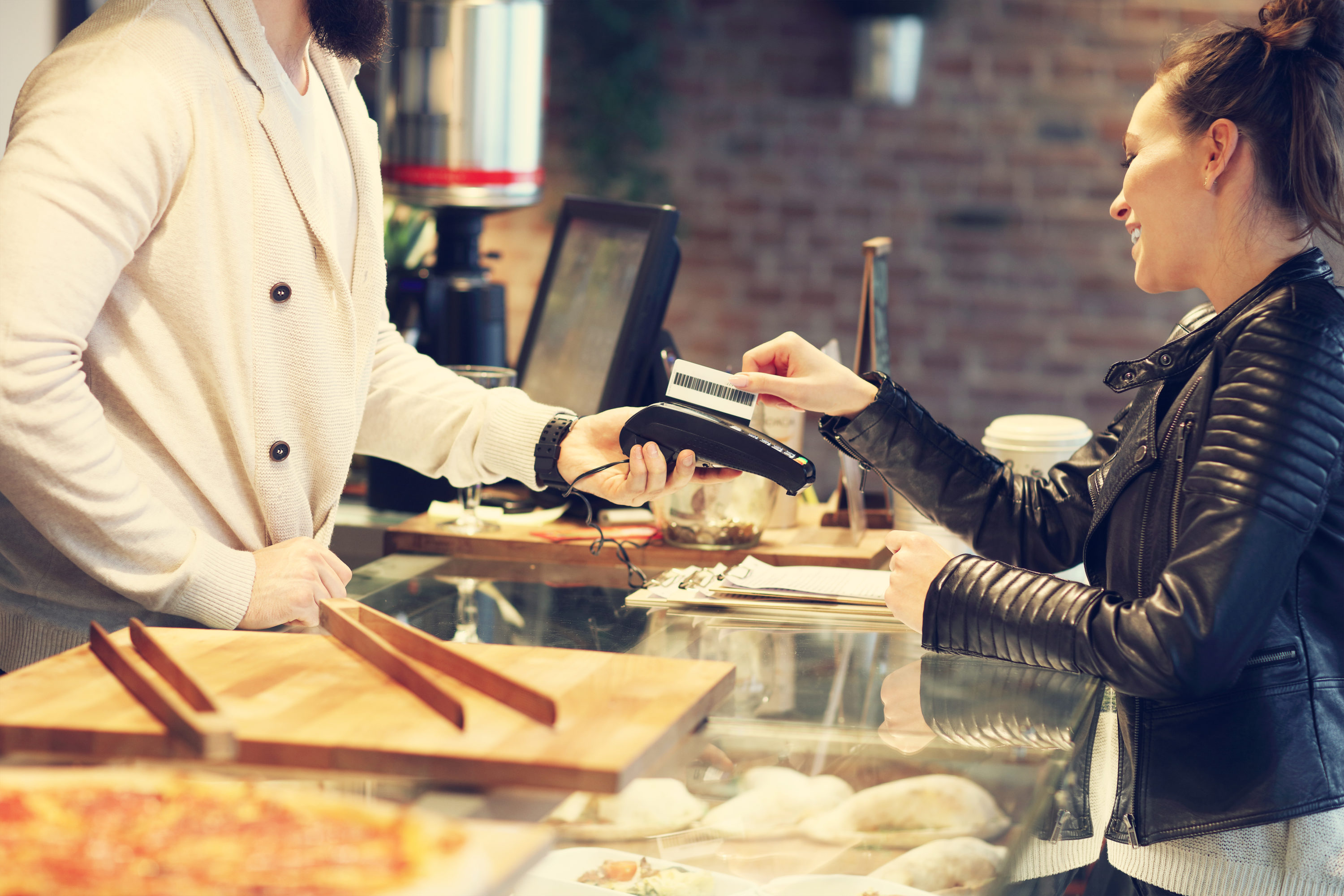 Woman paying by credit card in a restaurant