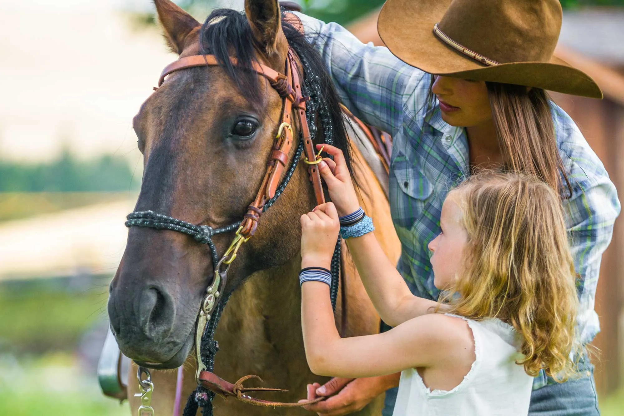 Wrangler teaching kid at Flints Forest Rangers Kids Club