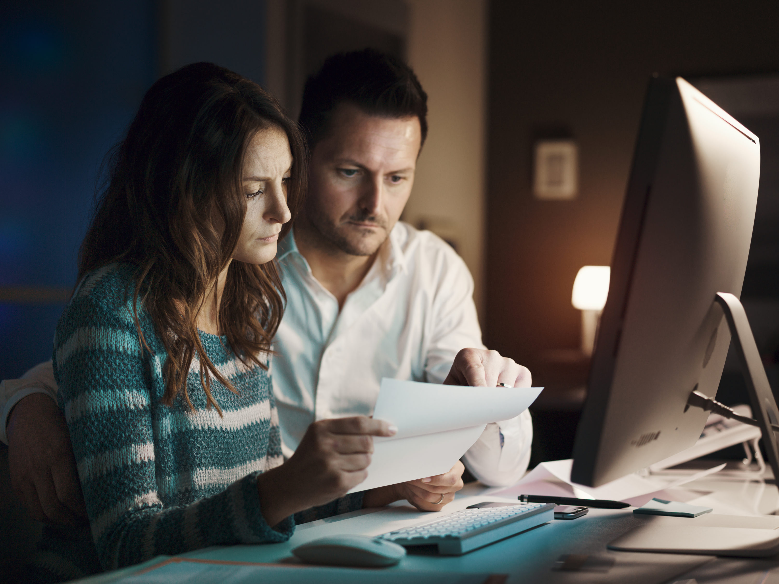 Couple checking past due collection accounts Couple checking past due collection accounts