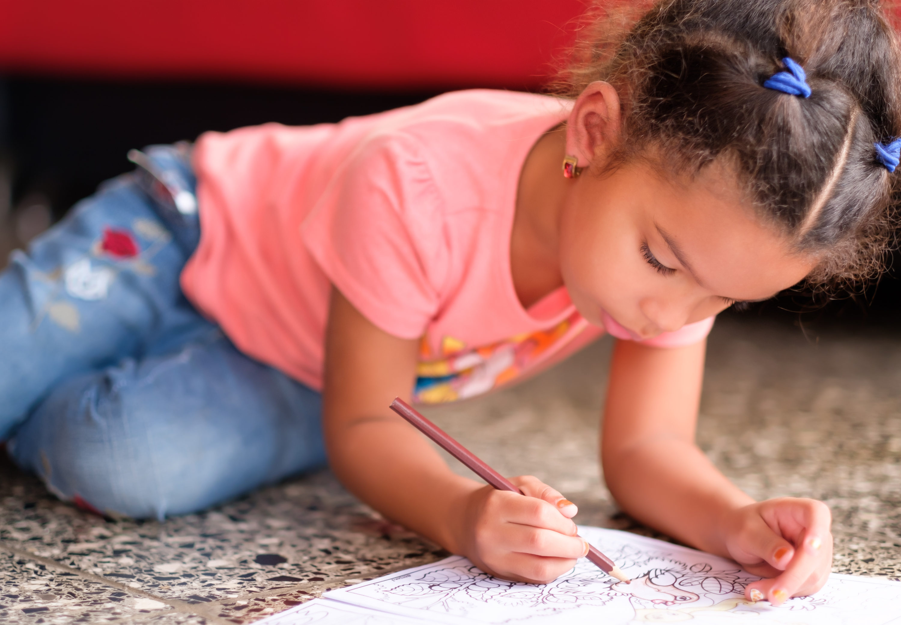 Girl coloring with colored pencil