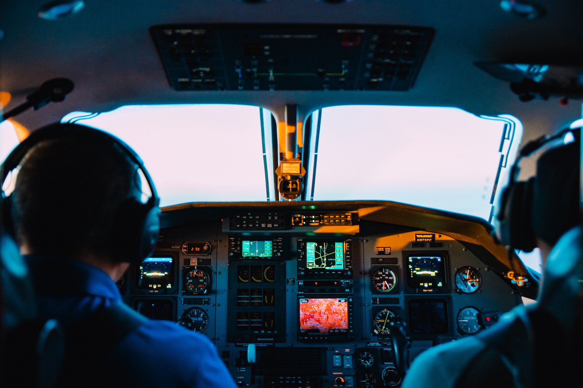 A cockpit with pilots A cockpit with pilots