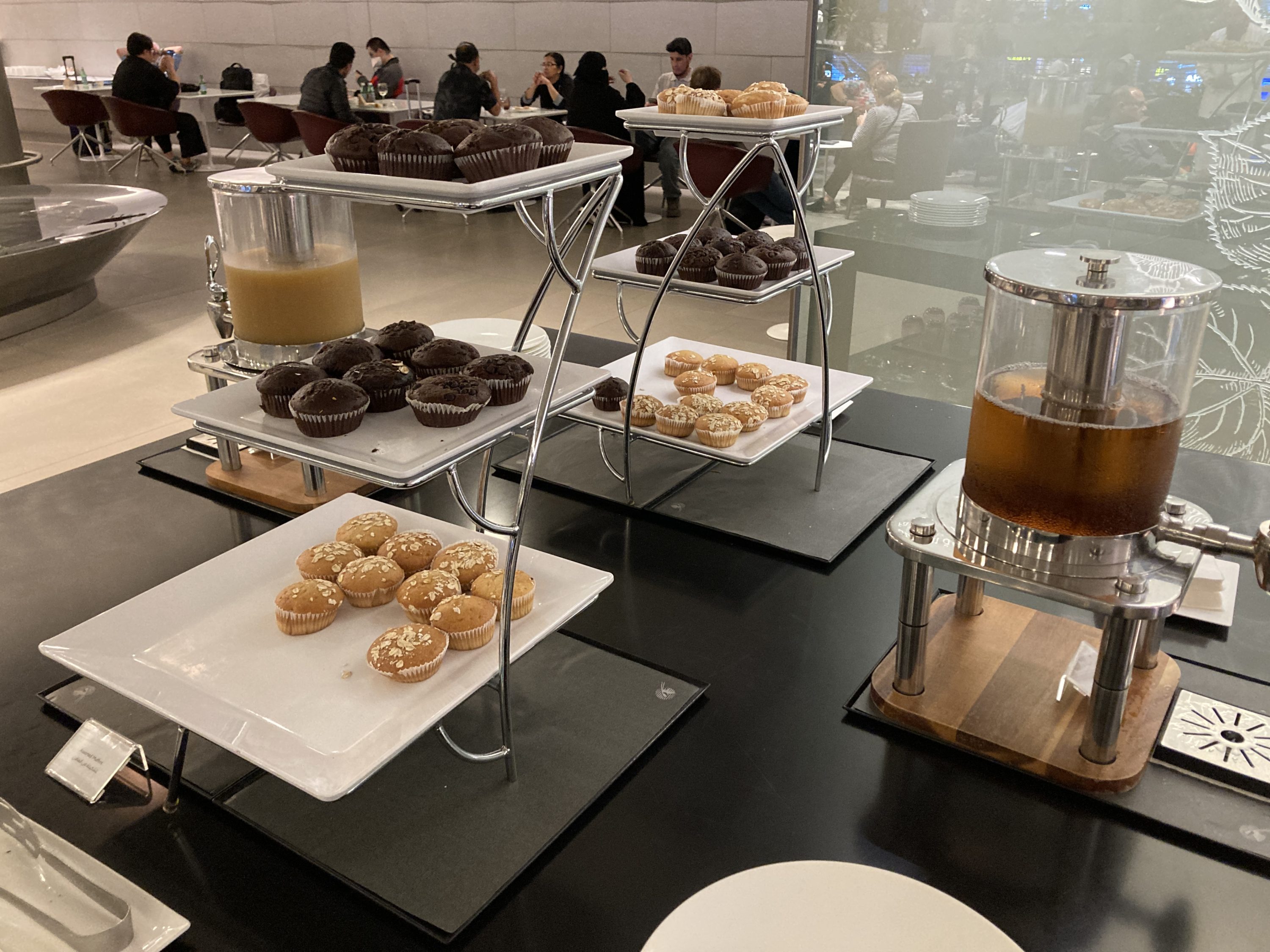 Al Maha Lounge Doha main muffins and juice Al Maha Lounge Doha main muffins and juice