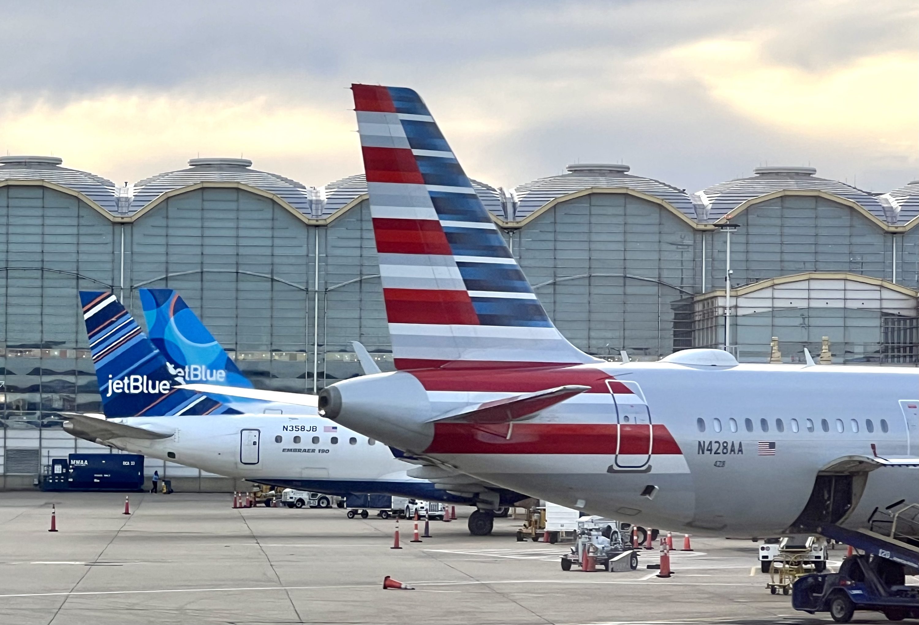 American Airlines and JetBlue aircraft at Washington DCA American Airlines and JetBlue aircraft at Washington DCA