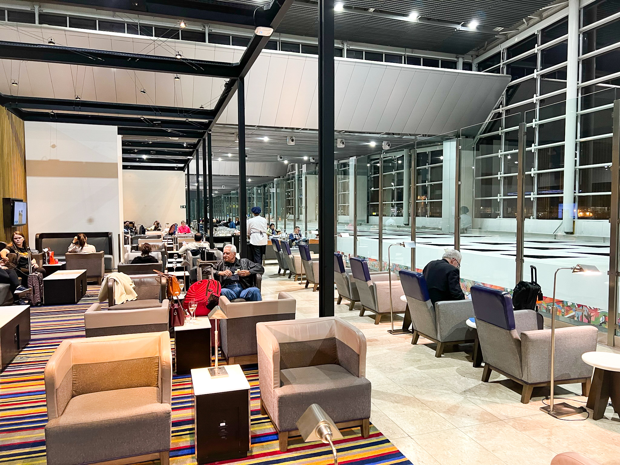Chair overlooking terminal at LATAM VIP Lounge GRU Chair overlooking terminal at LATAM VIP Lounge GRU