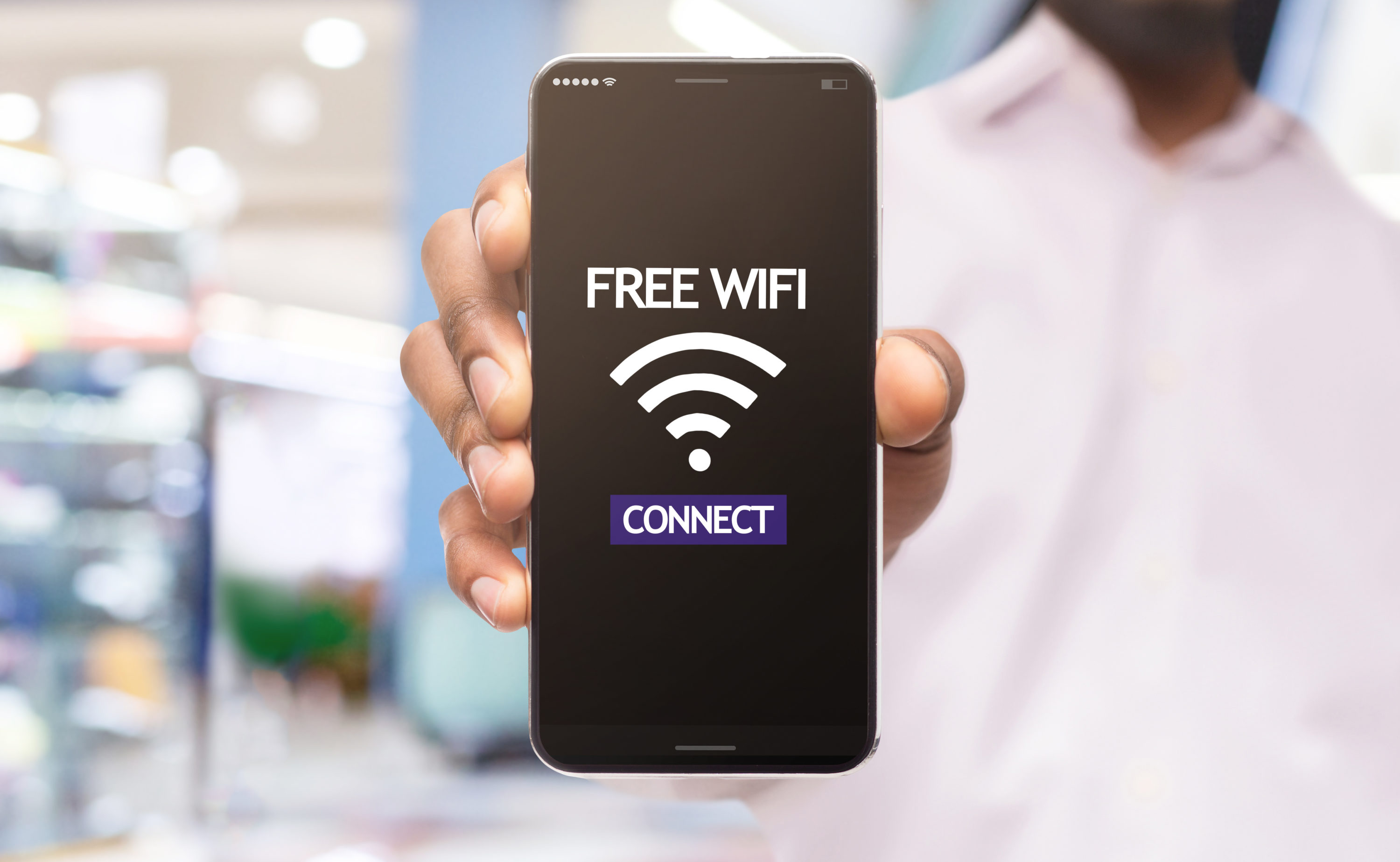 Free Wi Fi man holding phone Free Wi Fi man holding phone