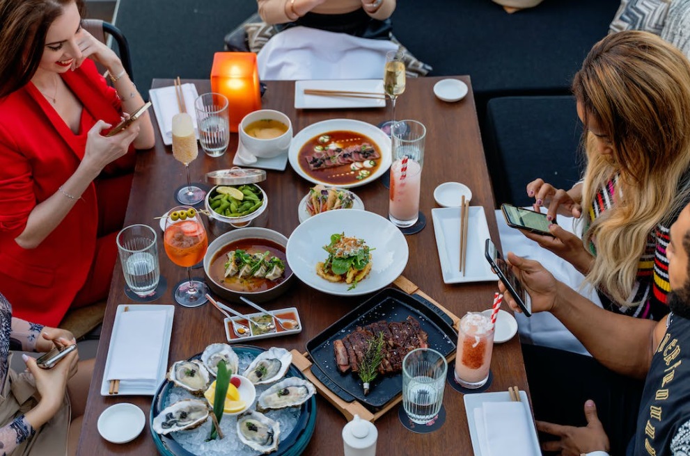Friends Eating at Restaurant
