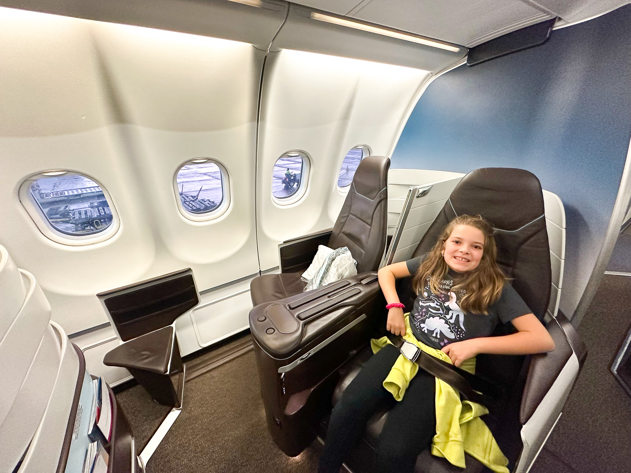 Hawaiian Airlines First Class girl in seat Hawaiian Airlines First Class girl in seat