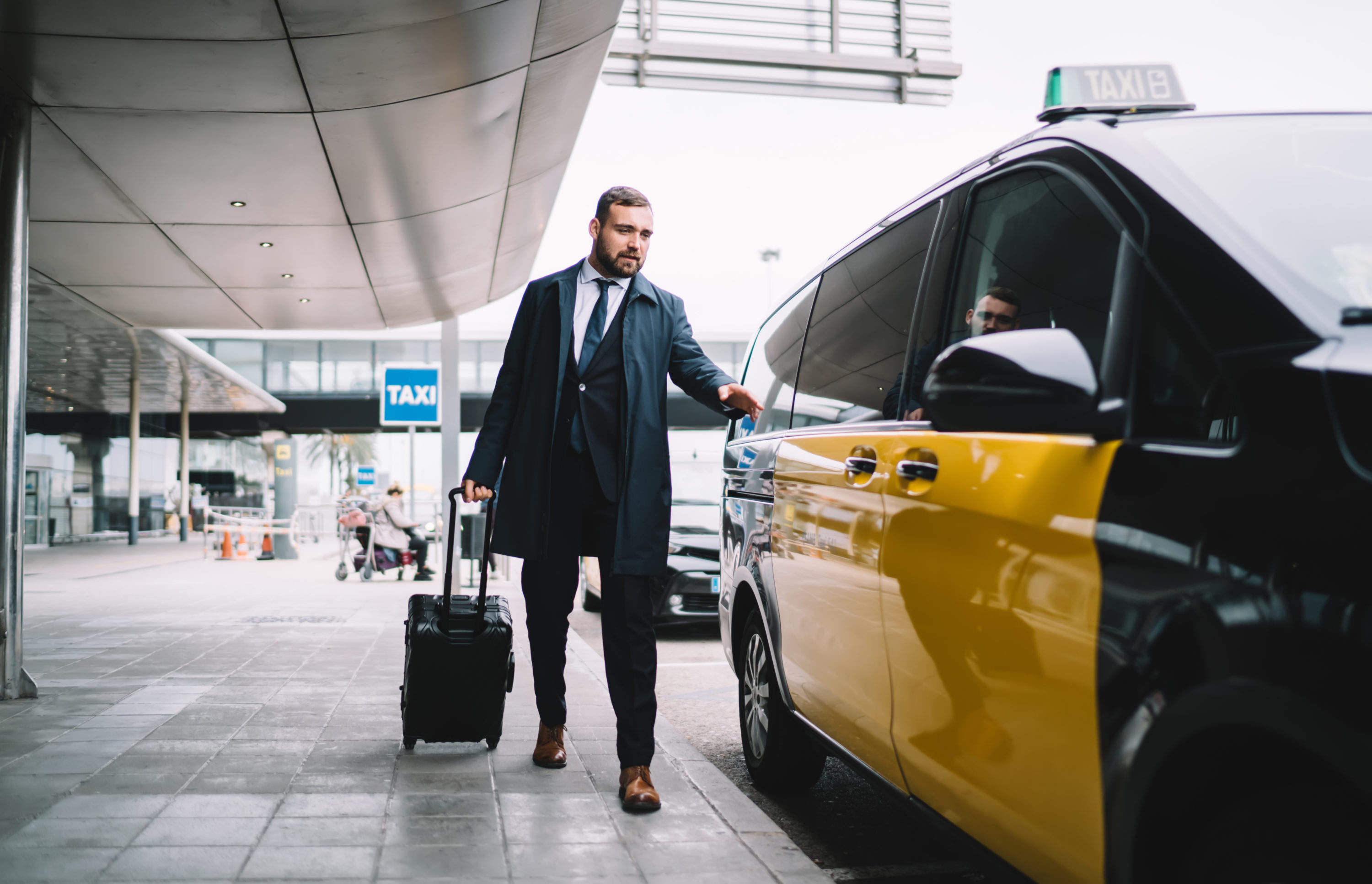 Man getting into a taxi Man getting into a taxi